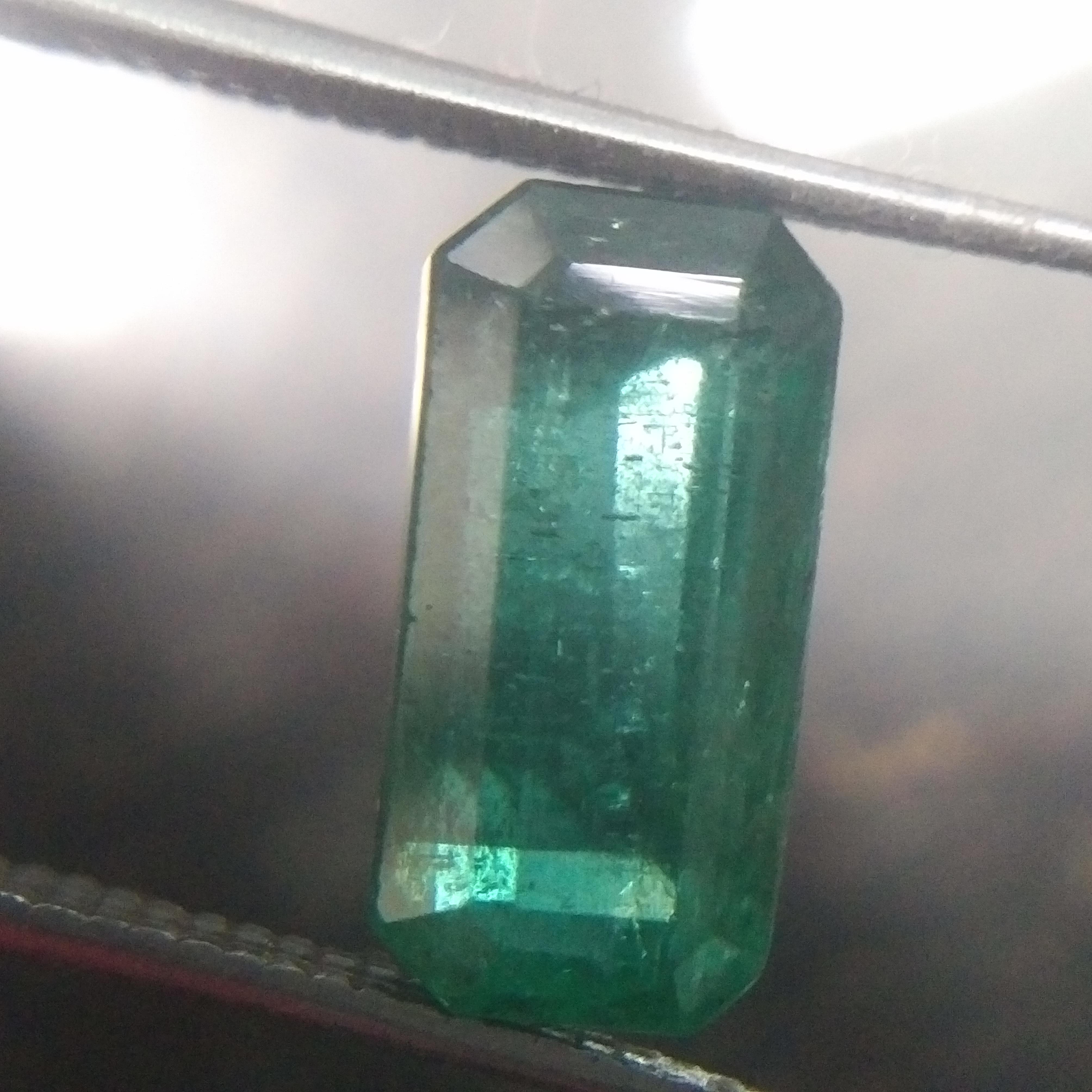 3.62ct medium green octagon step cut buguette  emerald