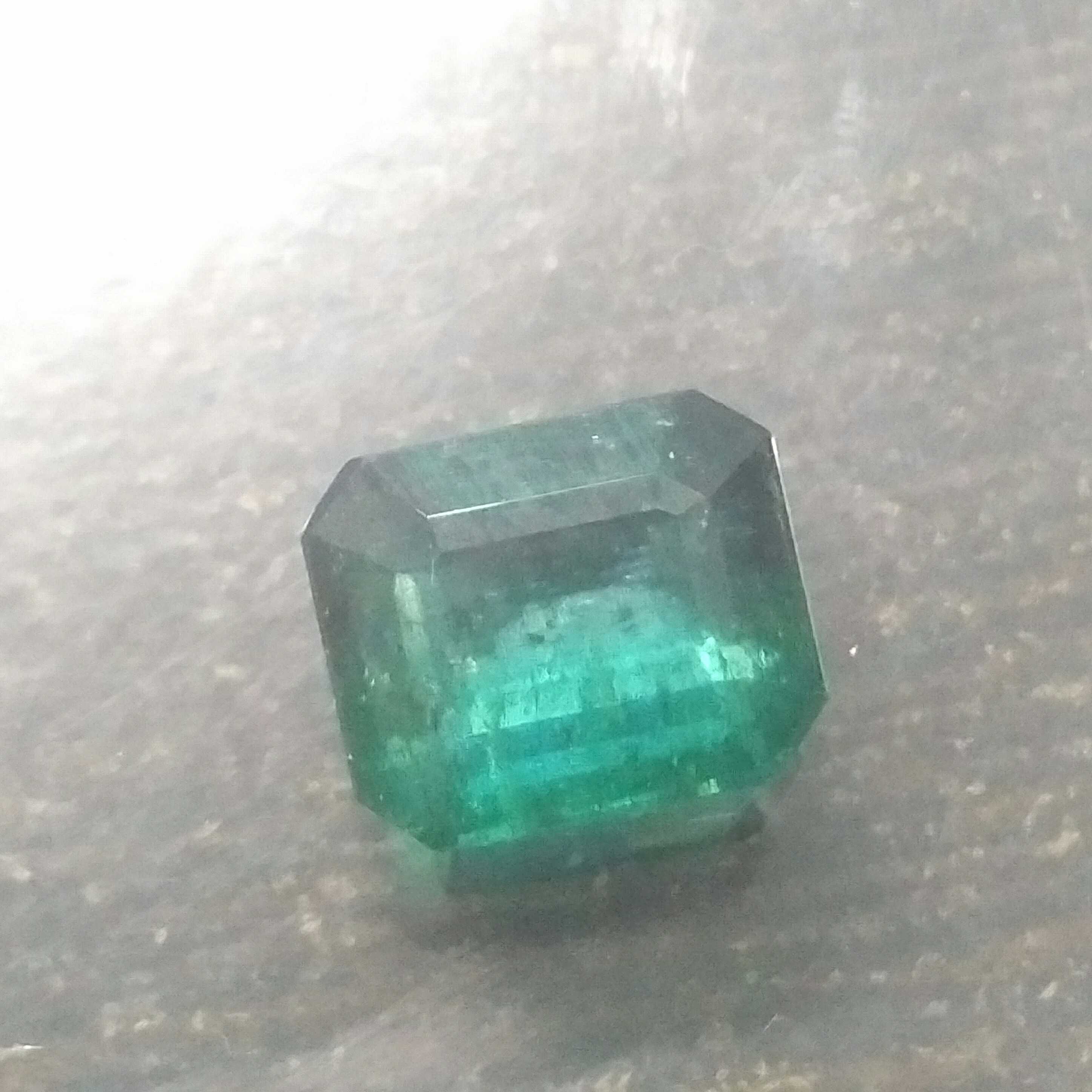 6.59ct octagon step cut deep glaas green Zambian emerald 