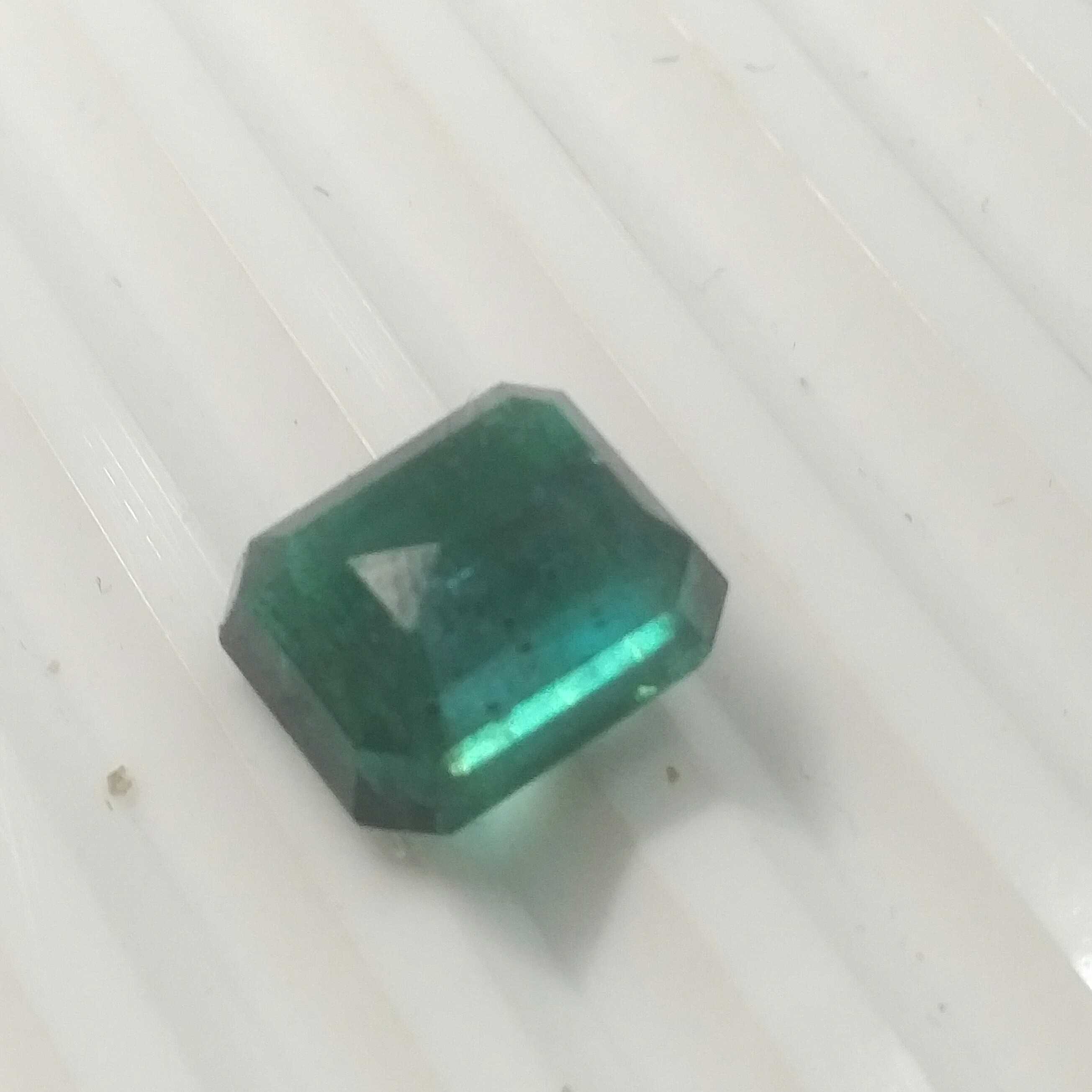 6.59ct octagon step cut deep glaas green Zambian emerald 