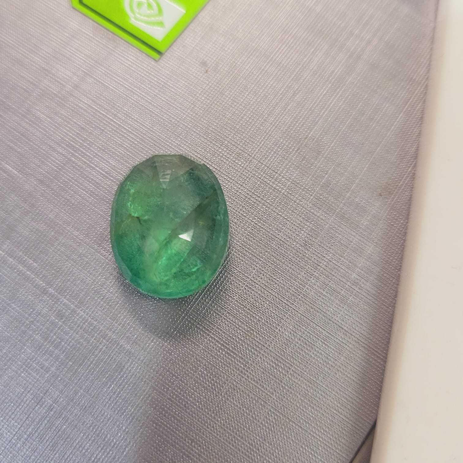 13.36ct IGI certified neon green Swat emerald gemstone 