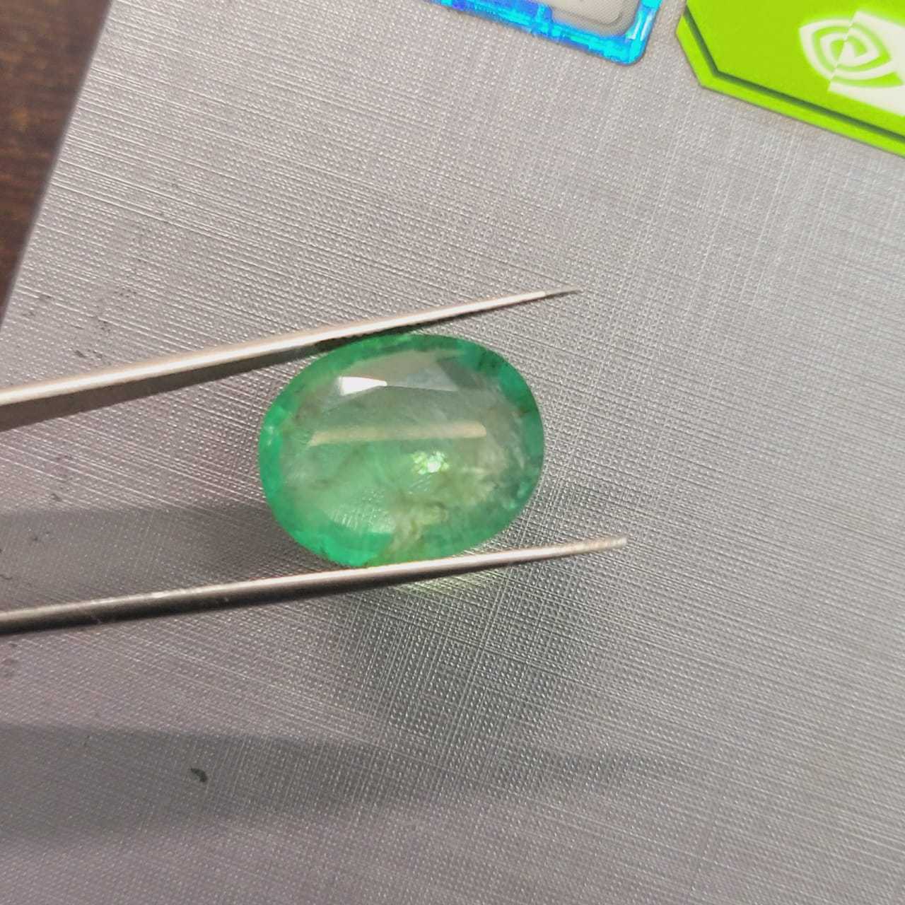 13.36ct IGI certified neon green Swat emerald gemstone 