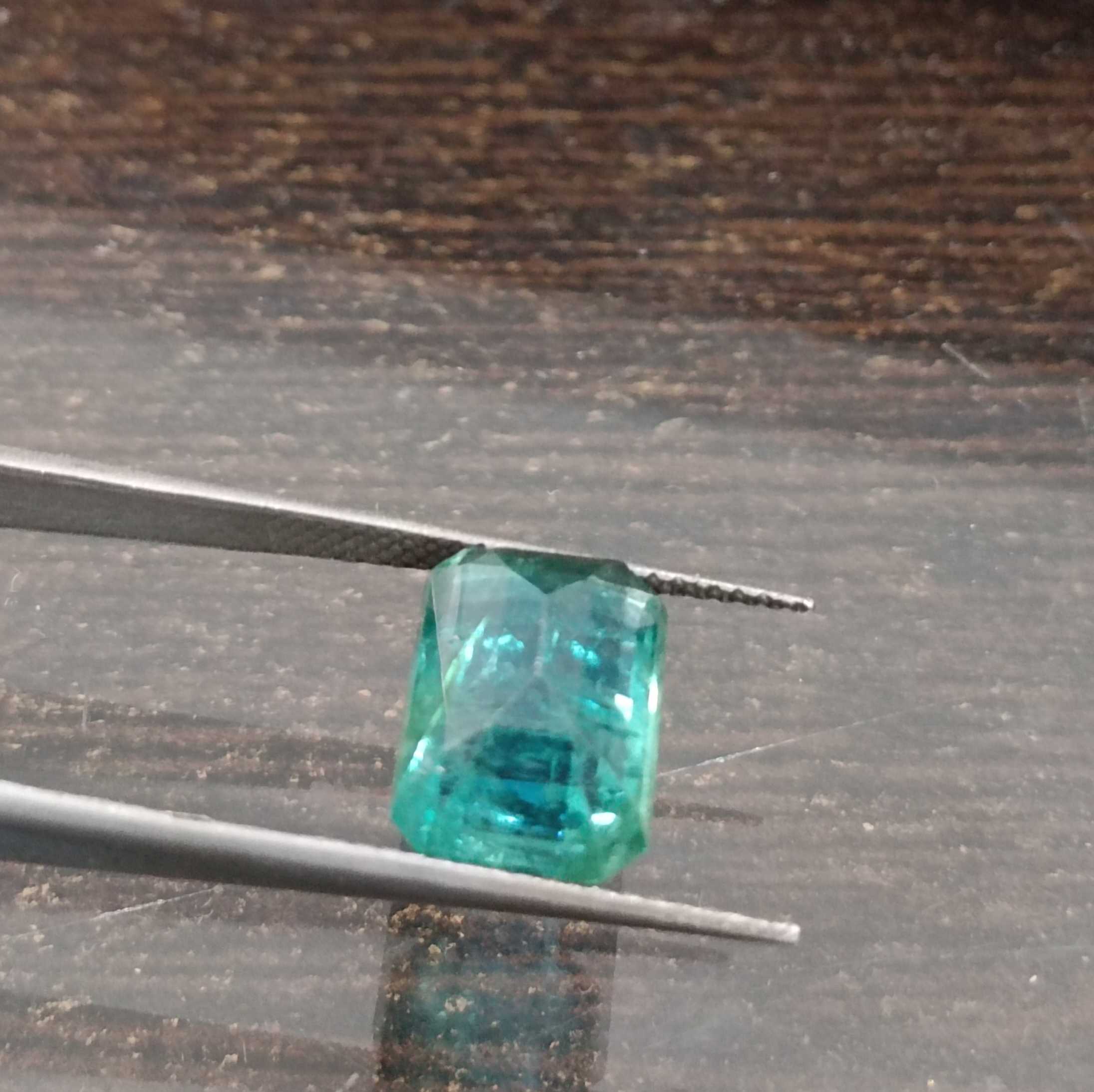 4.04ct algae green emerald cut emerald