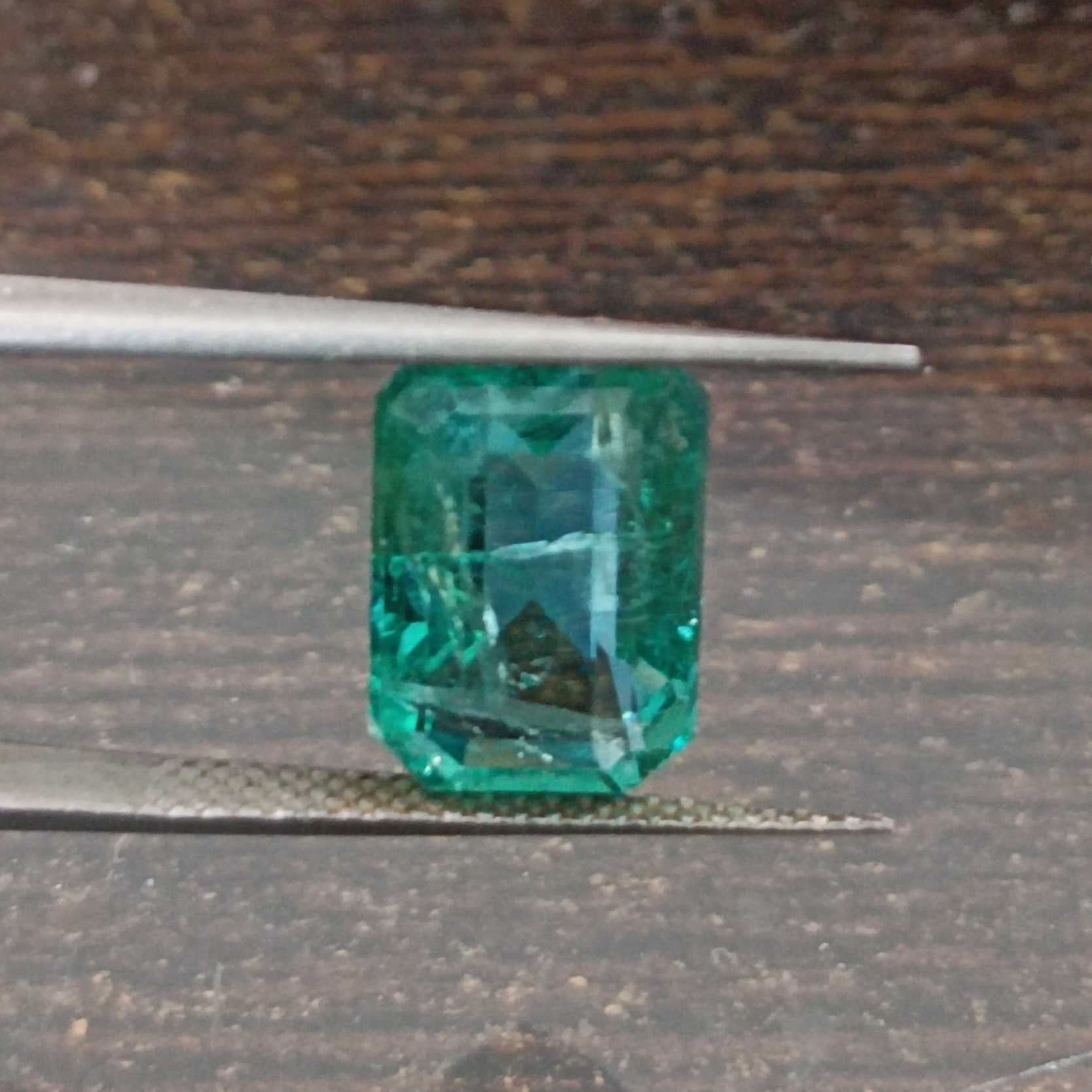 4.04ct algae green emerald cut emerald