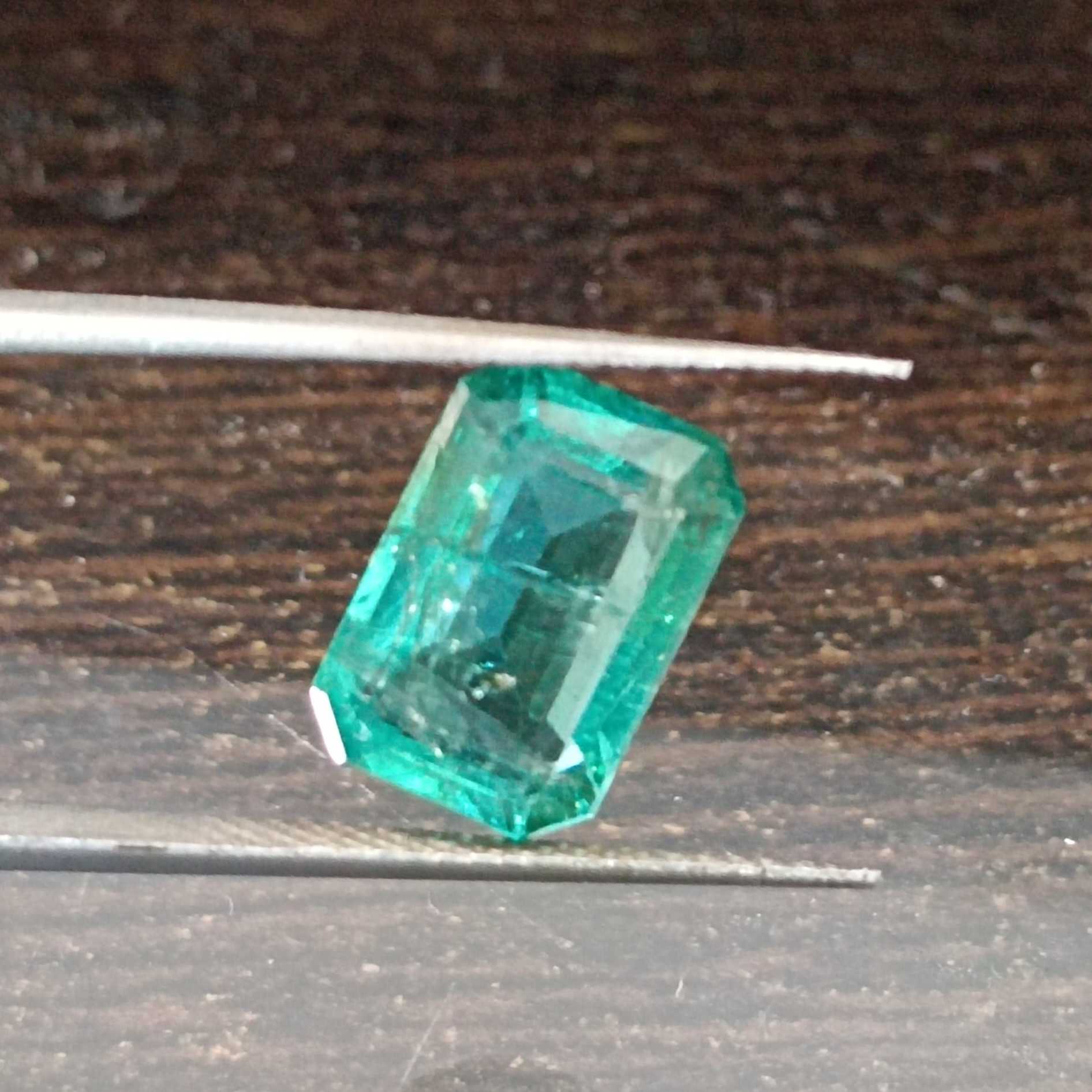 4.04ct algae green emerald cut emerald