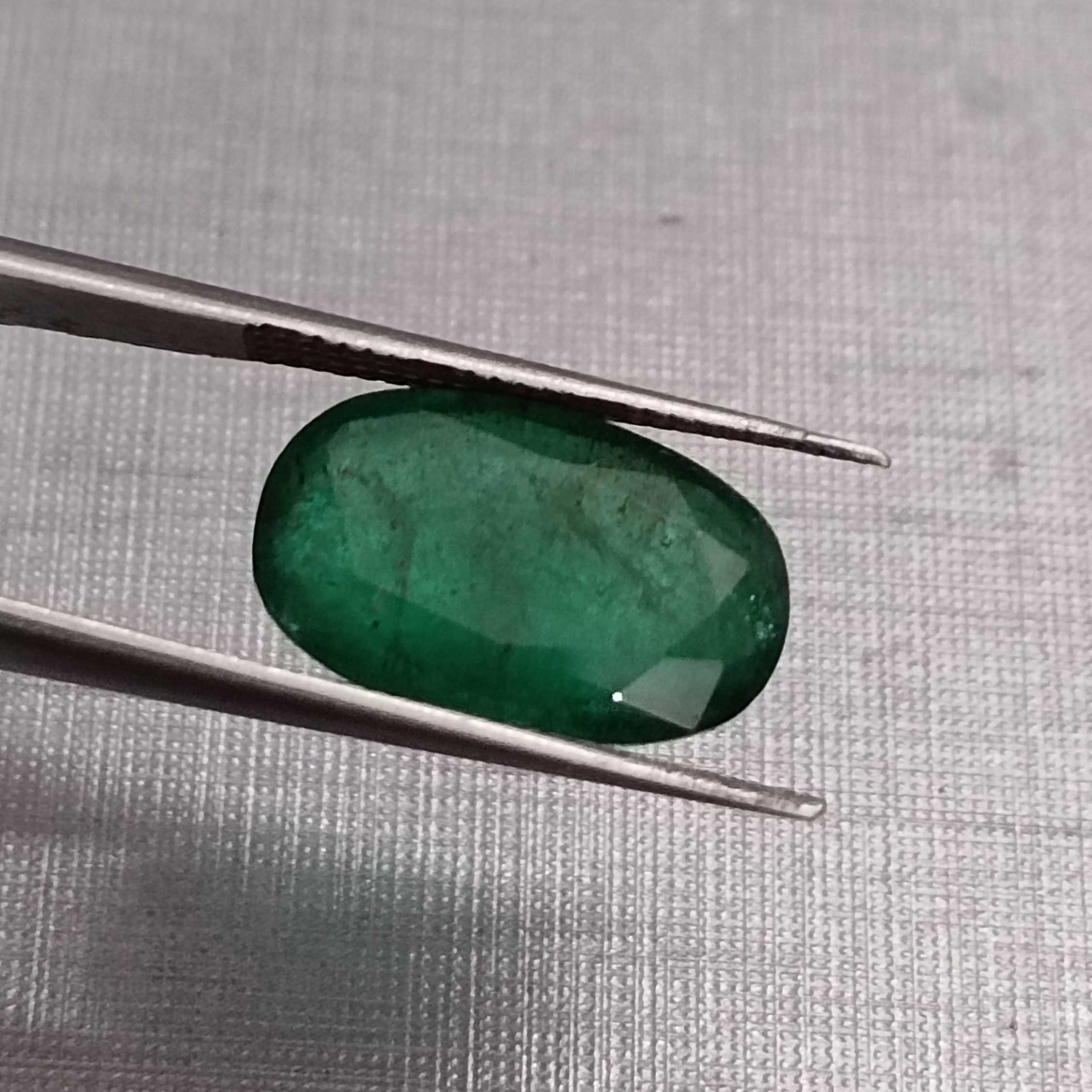 4.36ct deep green elongated oval cut Zambian emerald | Jewelfields