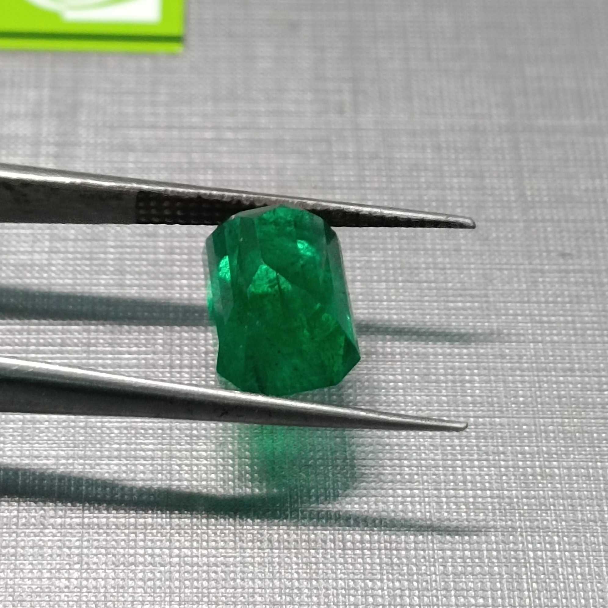 3.53ct Vivid Green Octagon Cut Emerald.