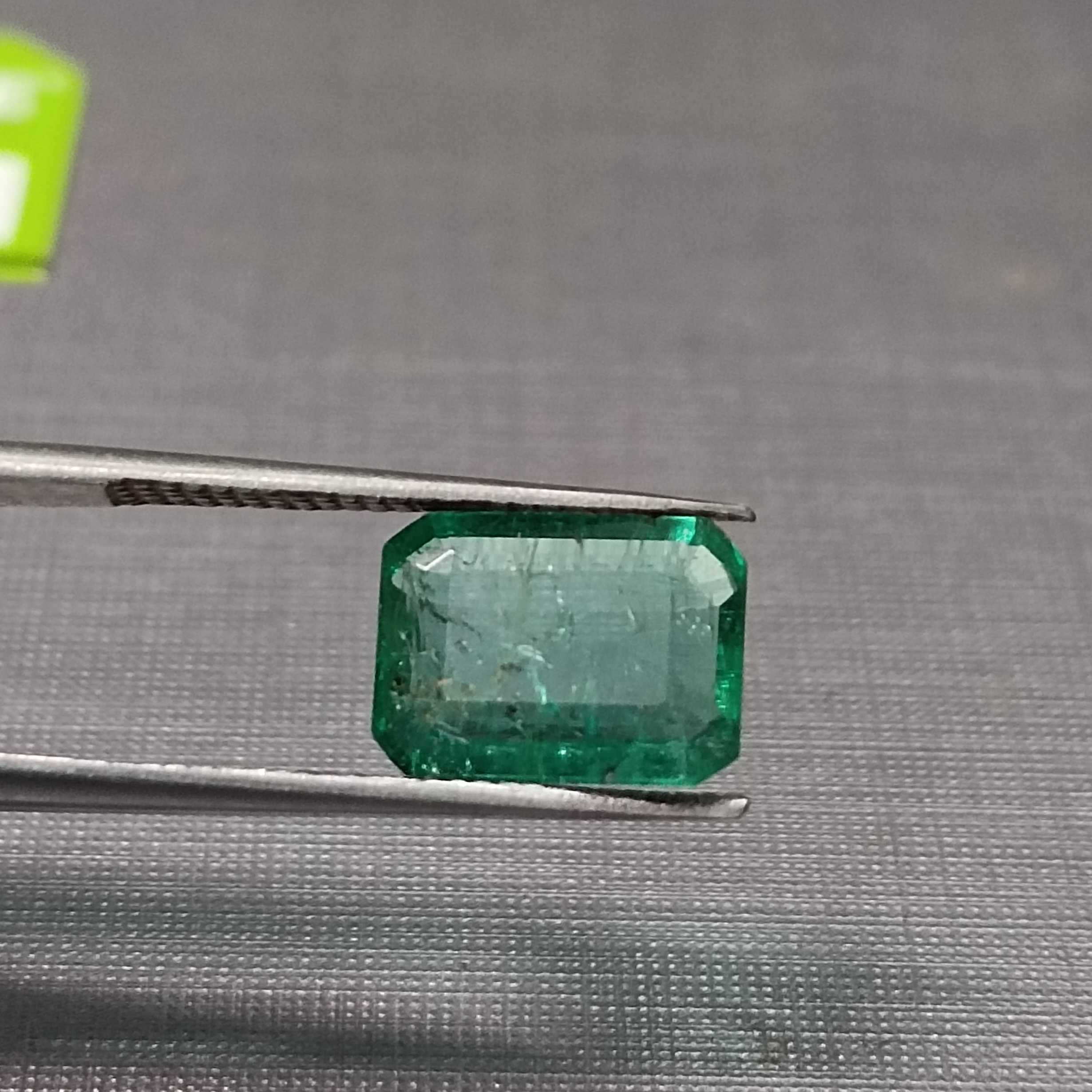 1.75 golden green octagon cut emerald gem. big table