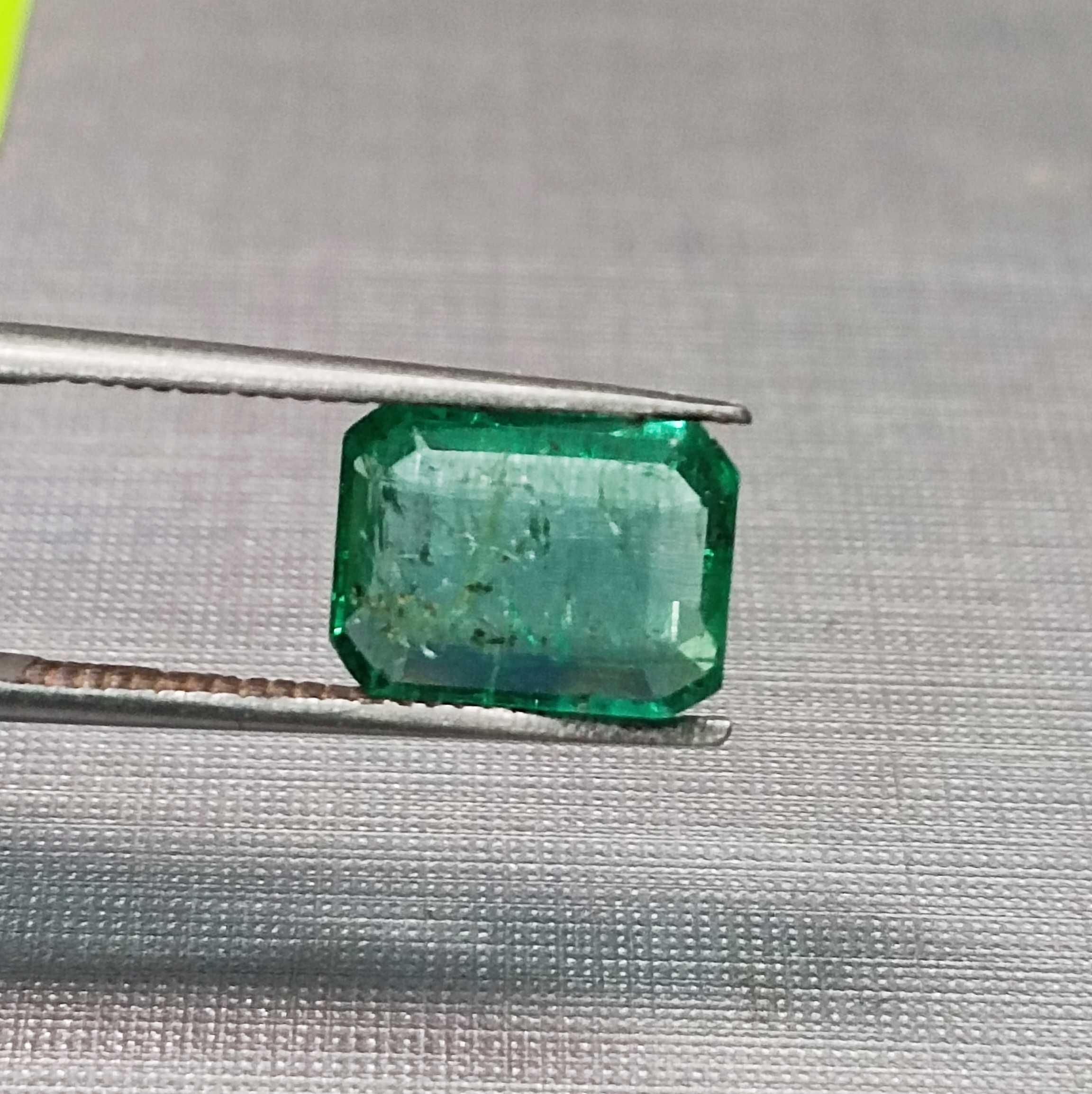 1.75 golden green octagon cut emerald gem. big table