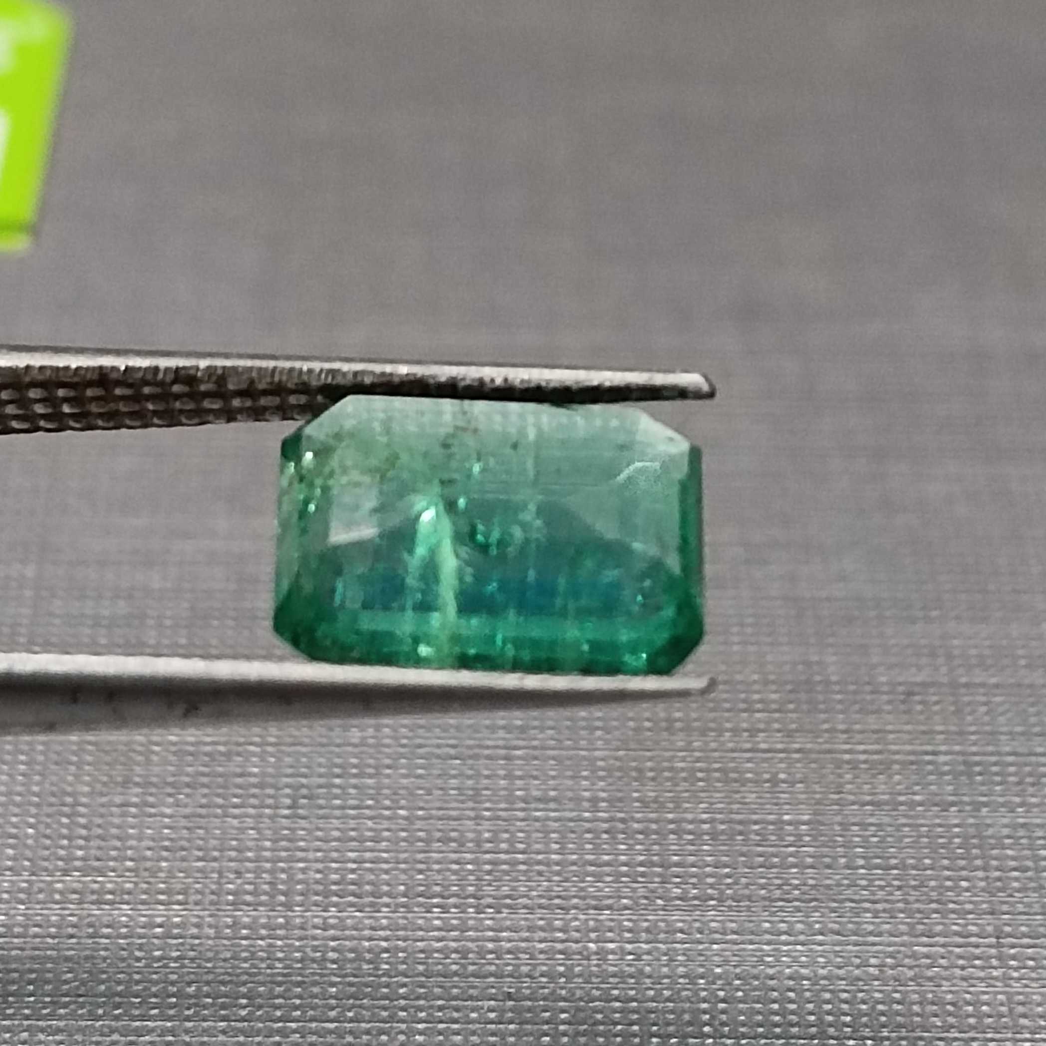 1.75 golden green octagon cut emerald gem. big table