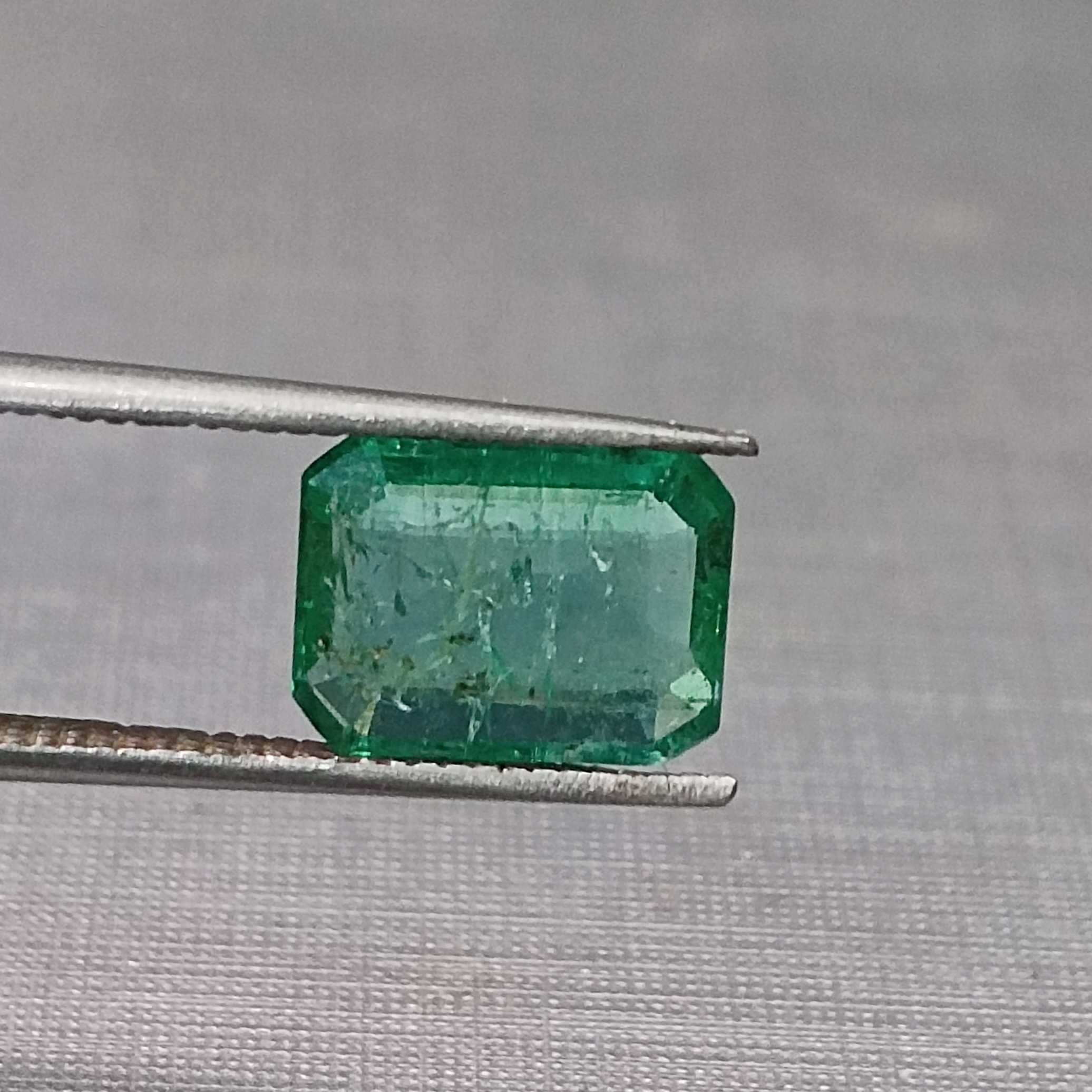 1.75 golden green octagon cut emerald gem. big table