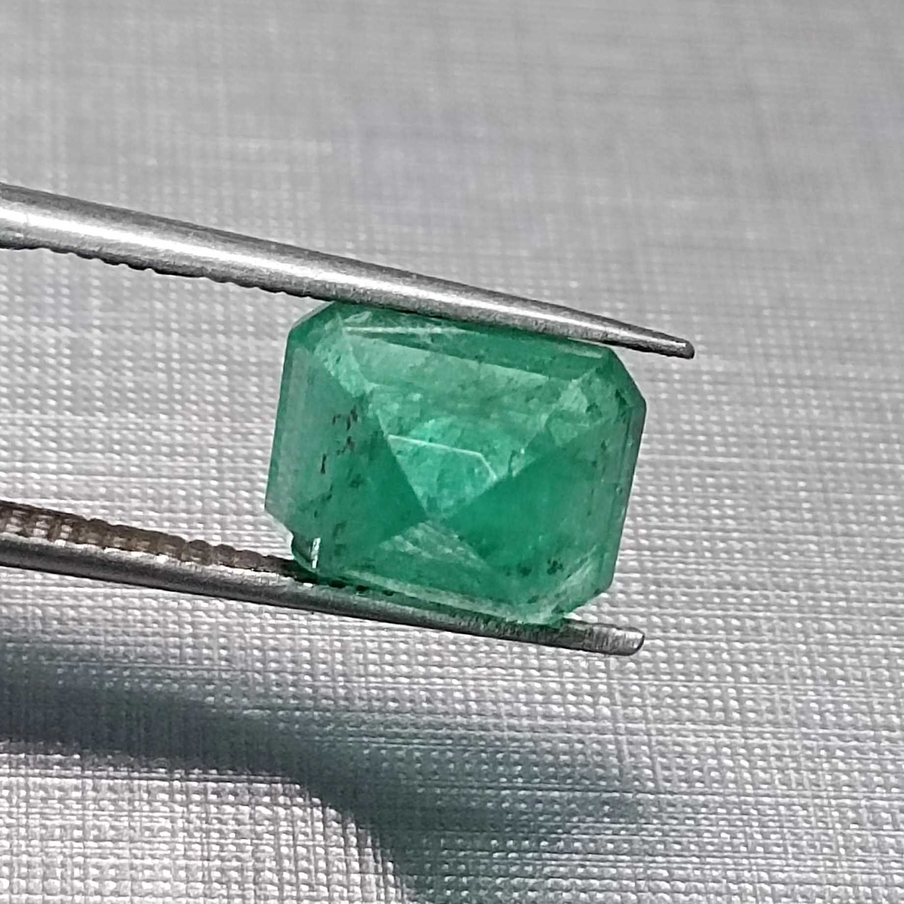 3.28ct medium vivid green emerald cut emerald