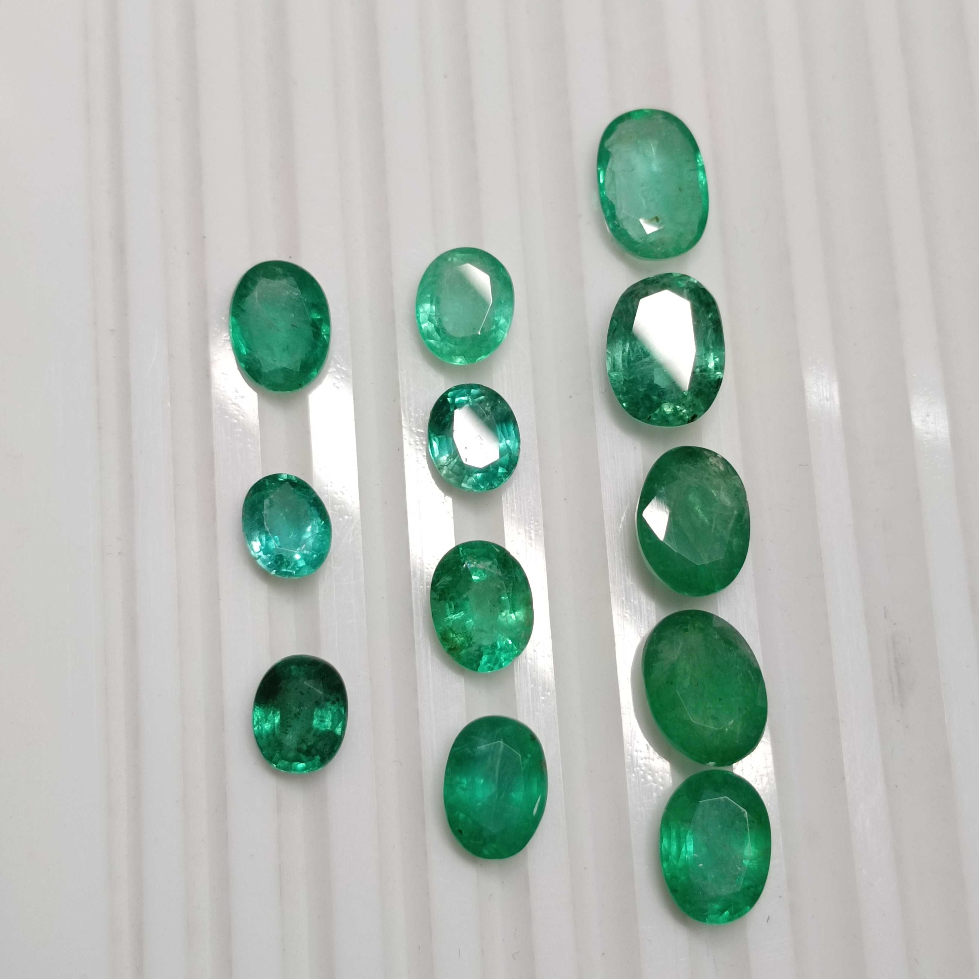 27.63ct medium to deep green oval cut emerald parcel /