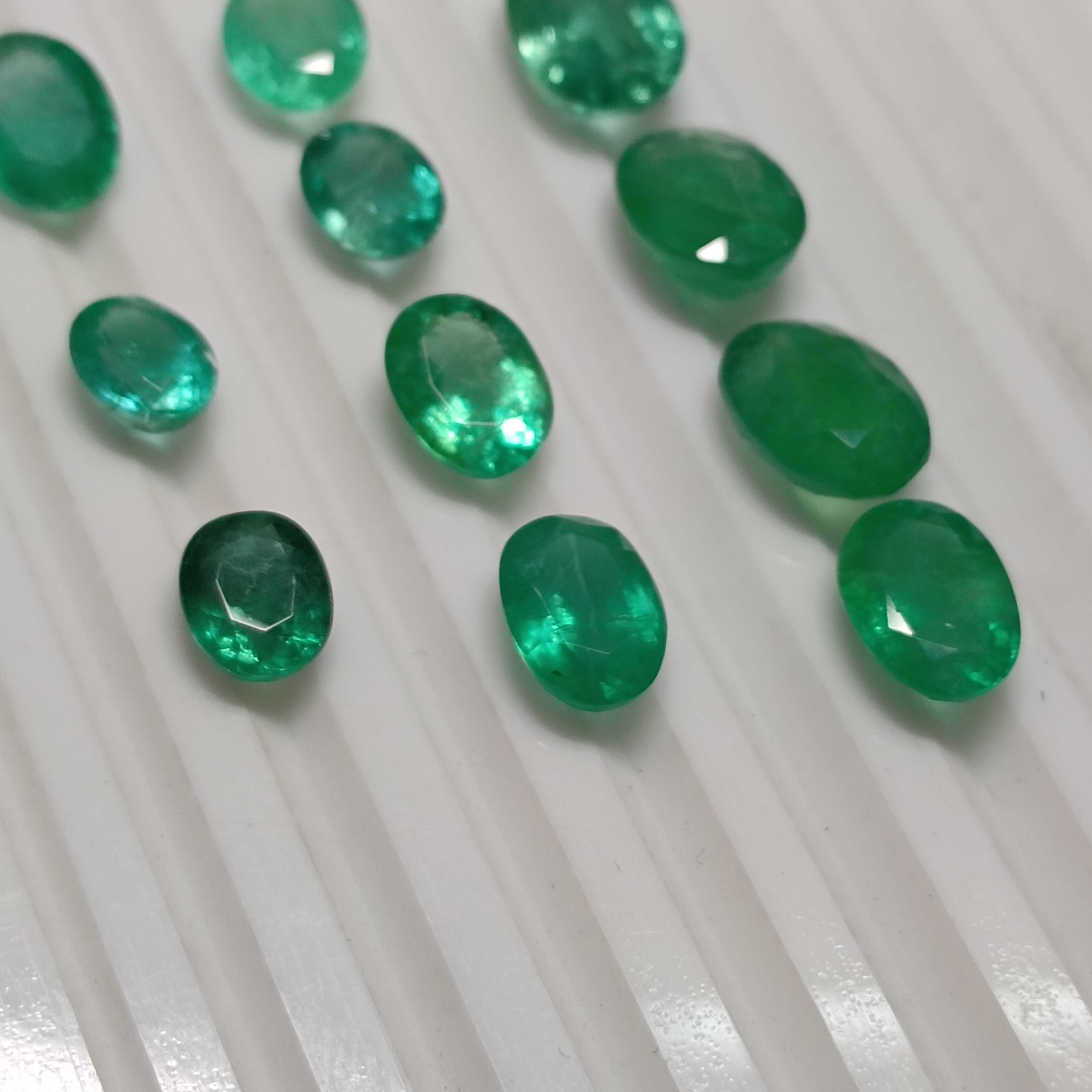 27.63ct medium to deep green oval cut emerald parcel 