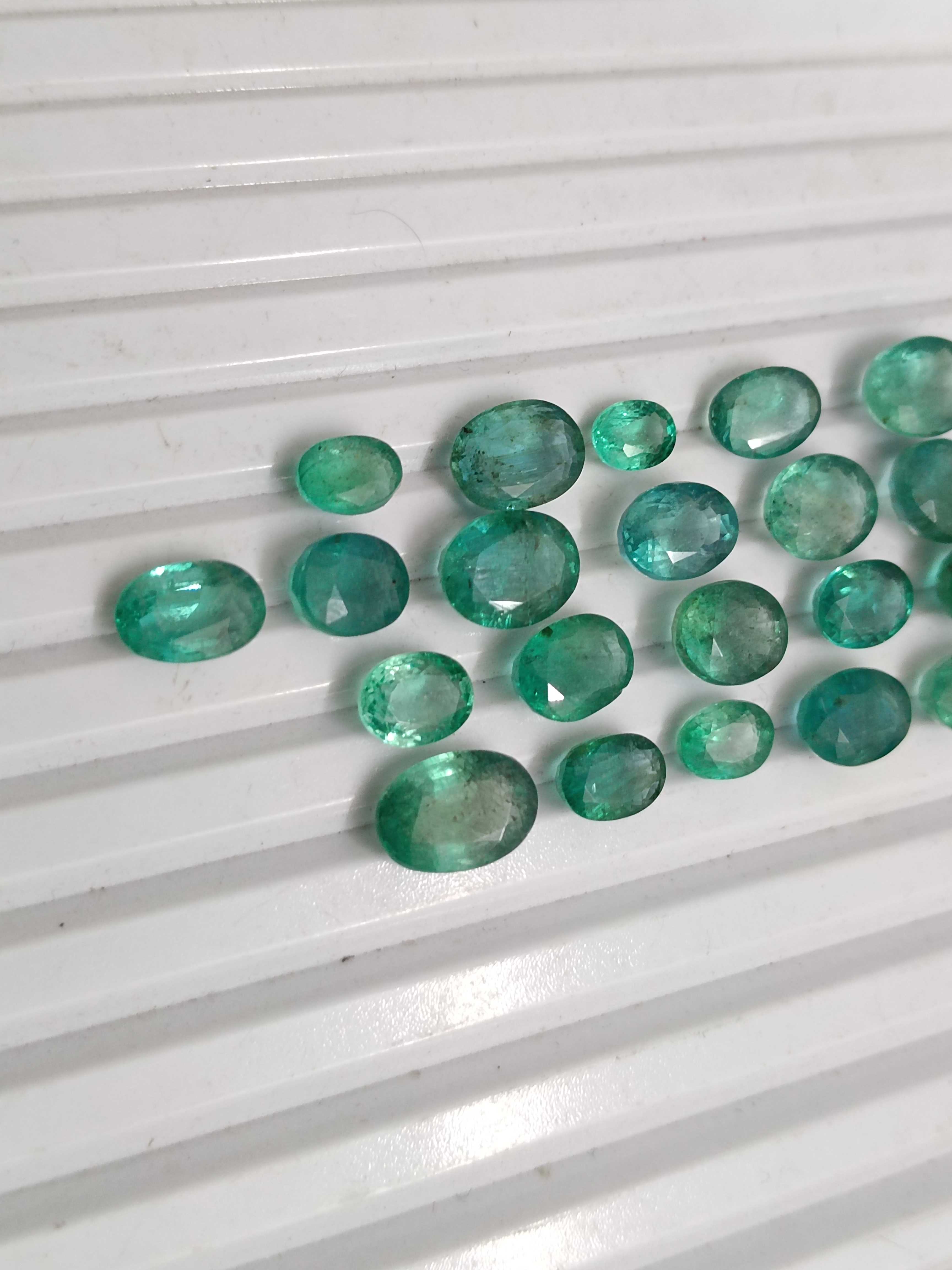 33.76ct oval shaped medium deep green emeralds 