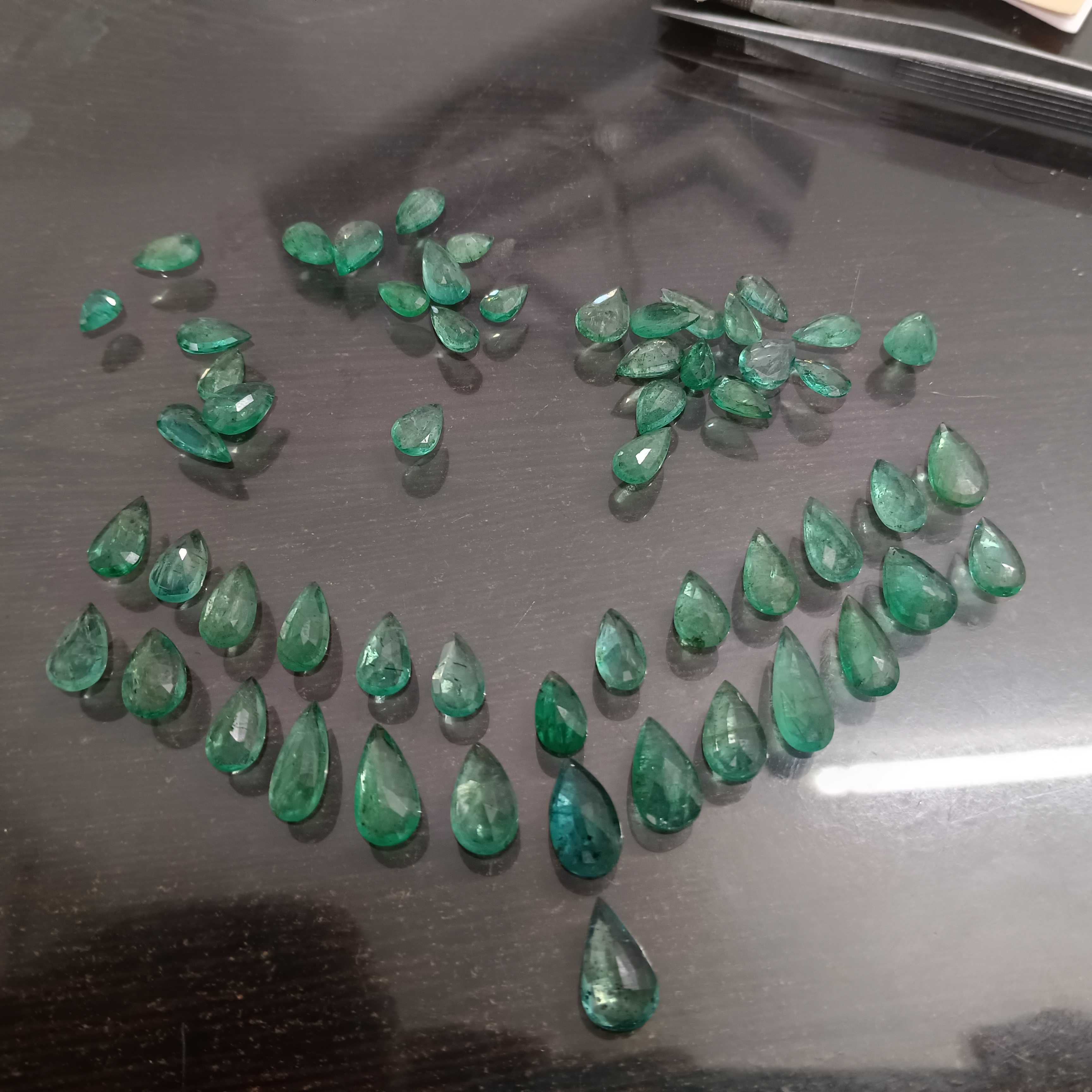 97ct medium green pear shape emerald layout parcel