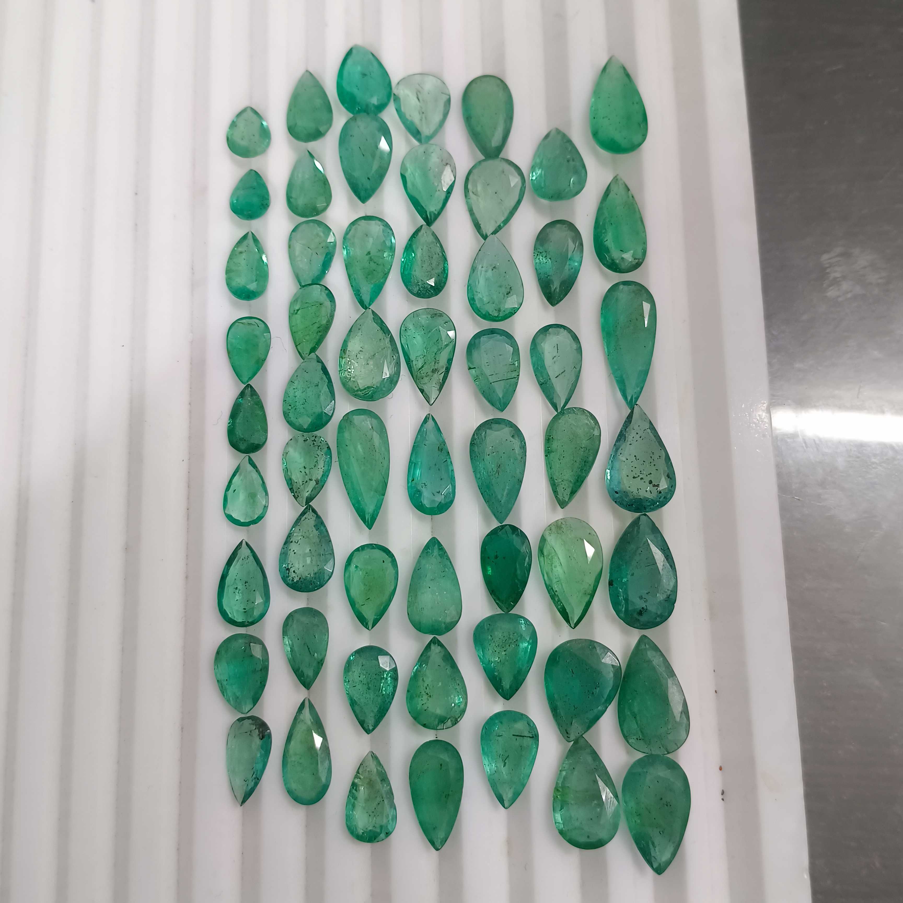 97ct medium green pear shape emerald layout parcel
