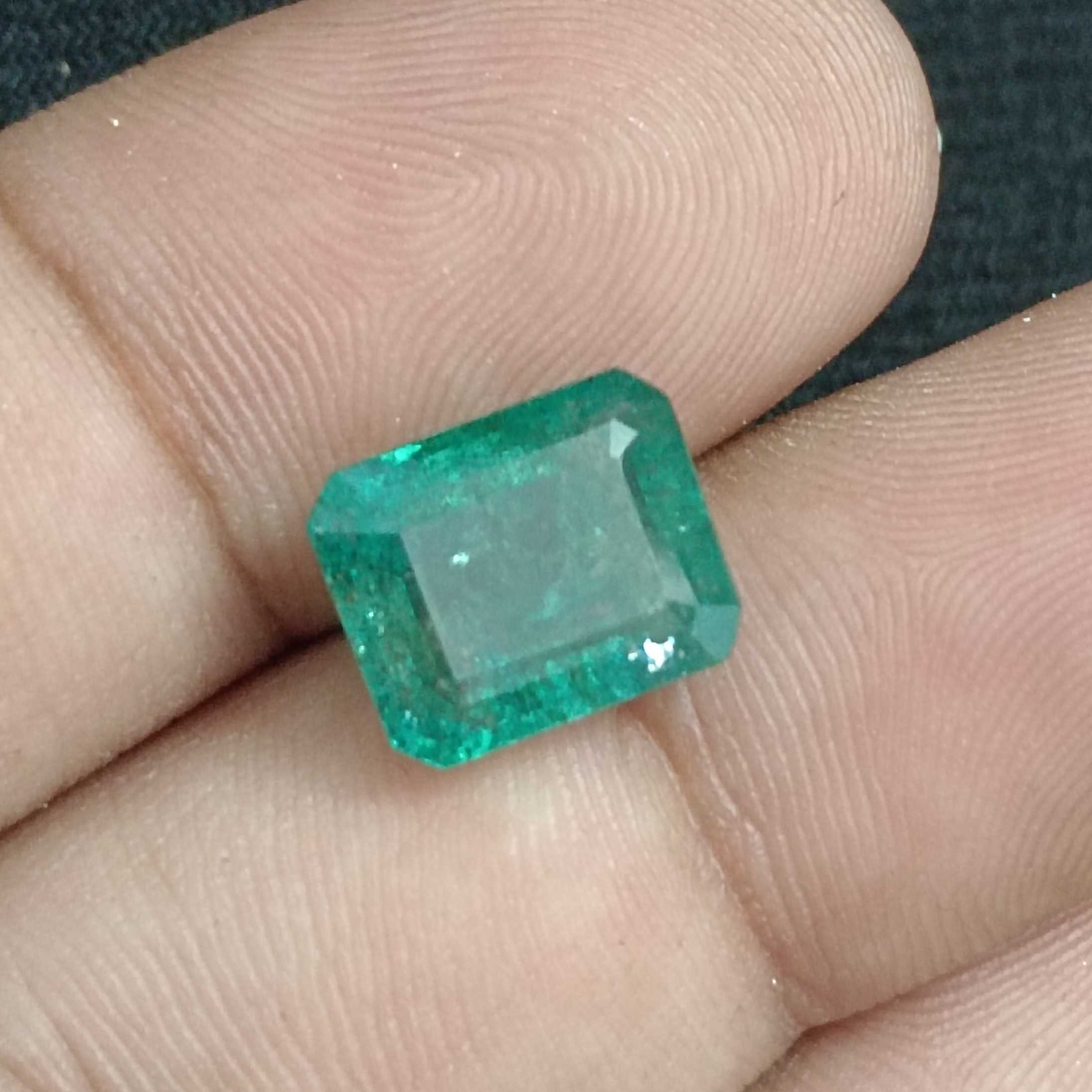 6.14ct IGI certified bluish green octagon cut emerald/