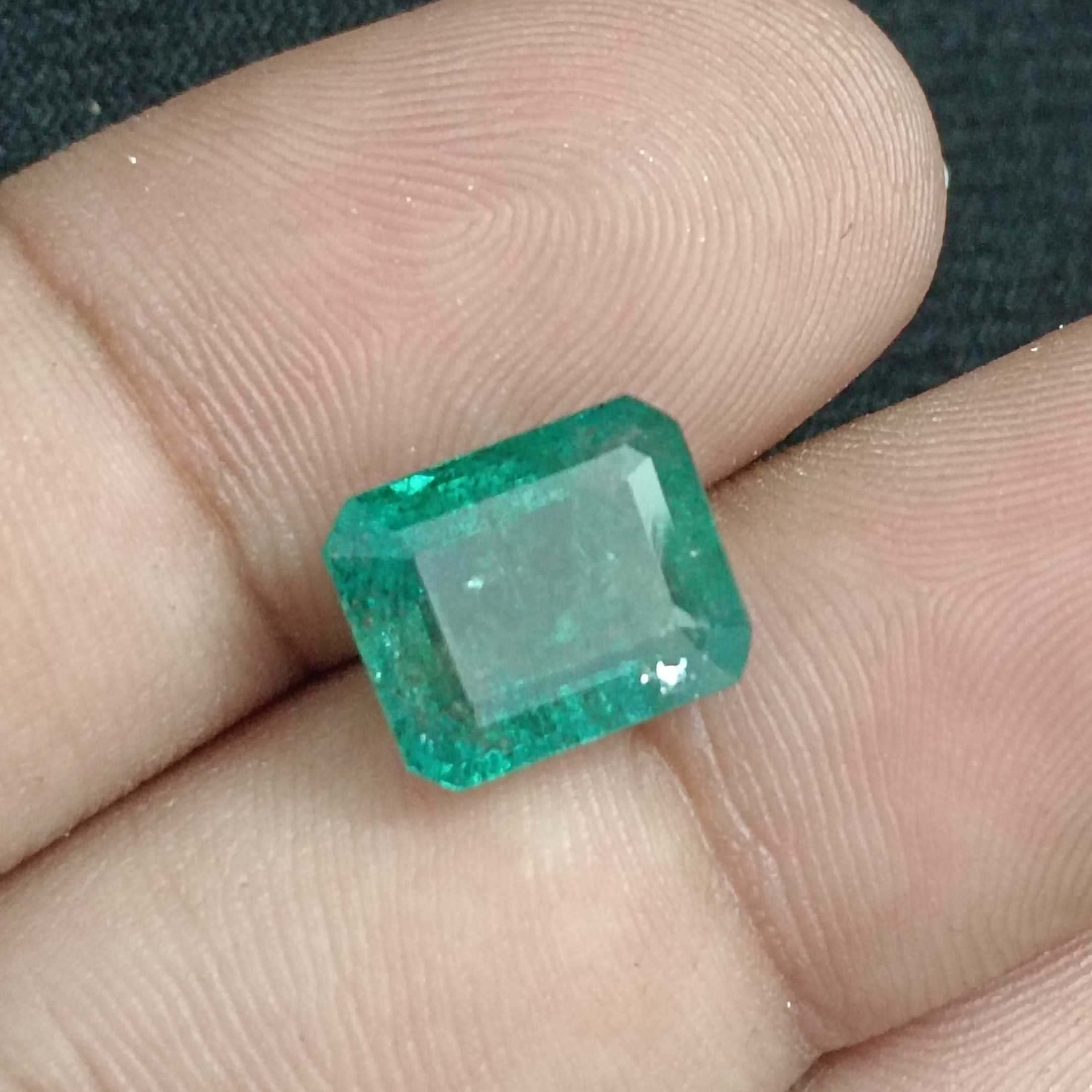 6.14ct IGI certified bluish green octagon cut emerald