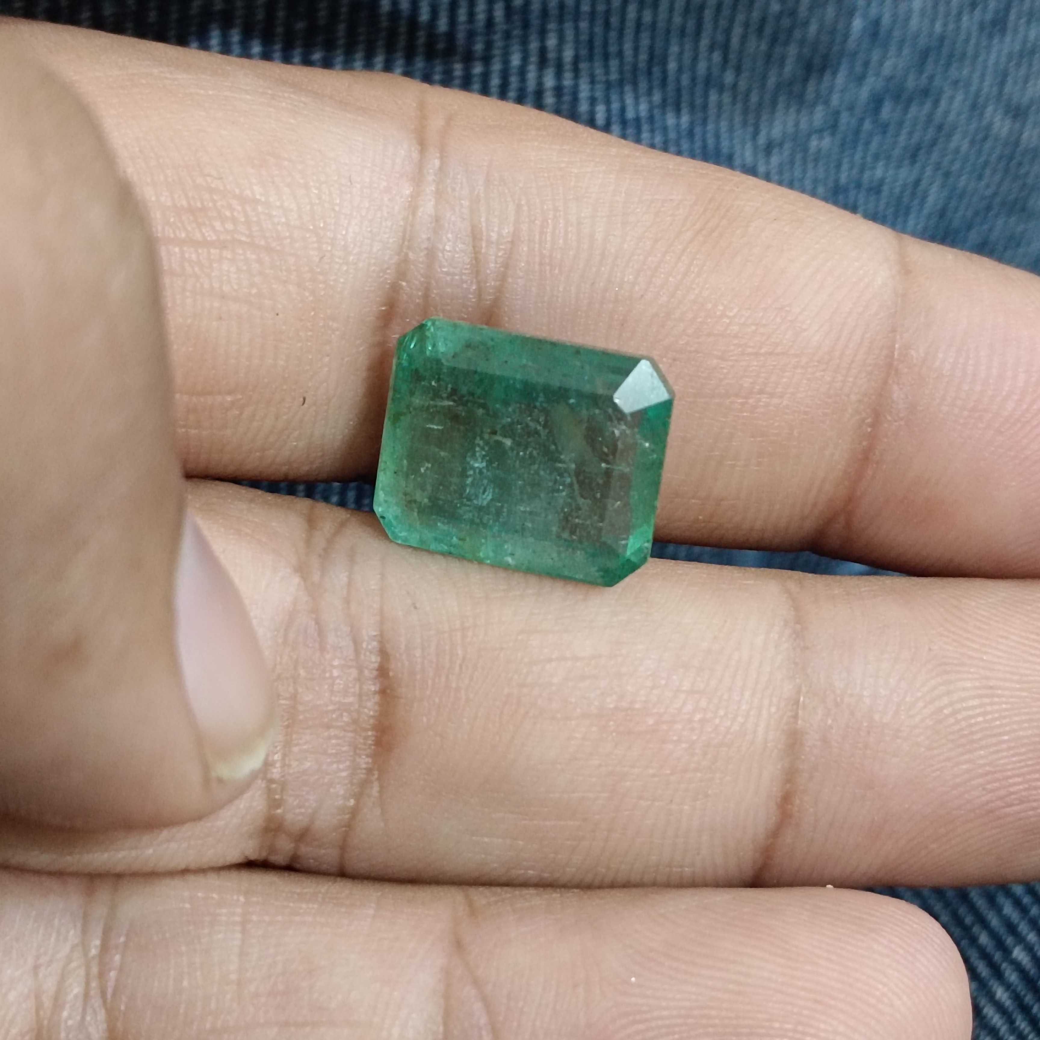 11.94ct medium light green octagon cut emerald