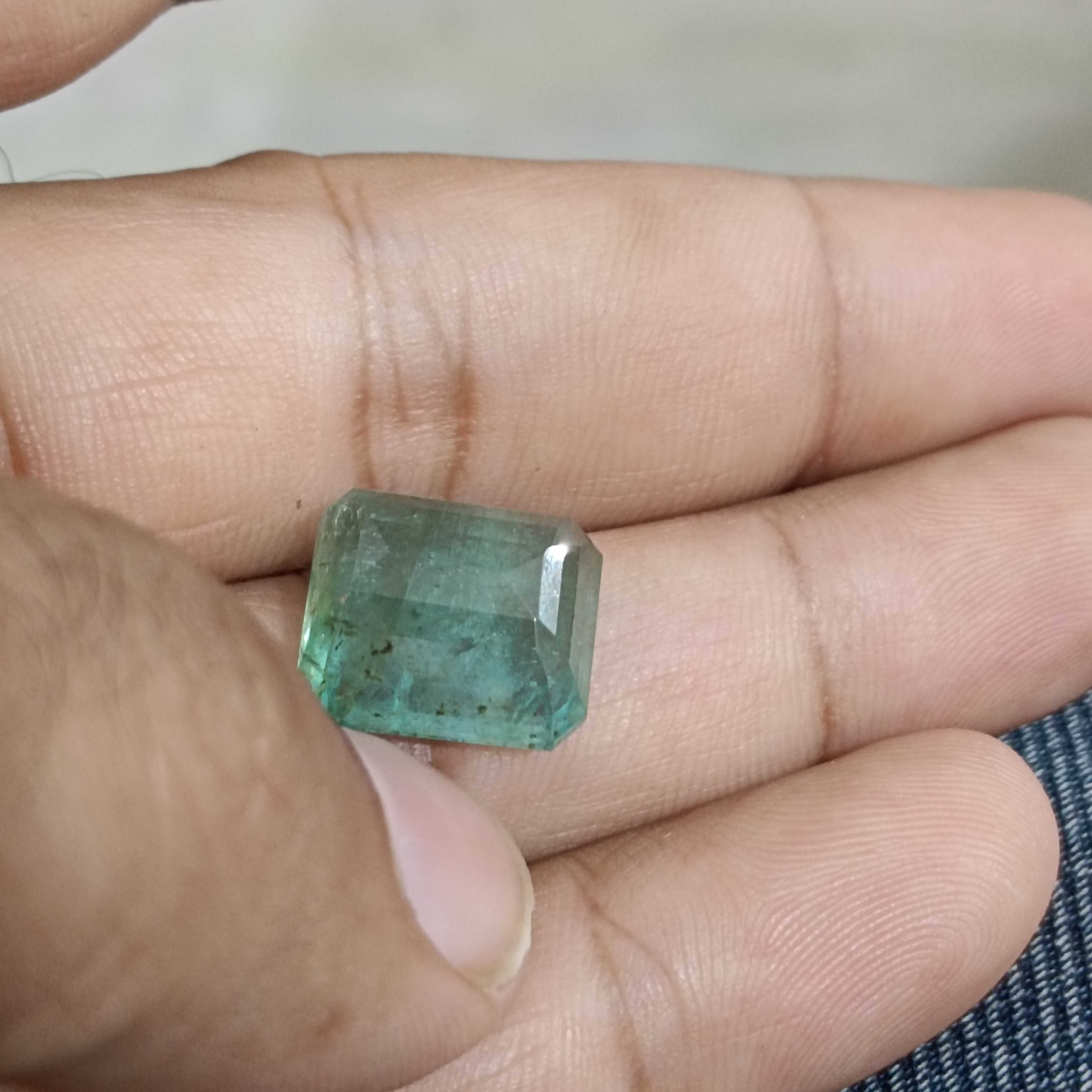 11.94ct medium light green octagon cut emerald