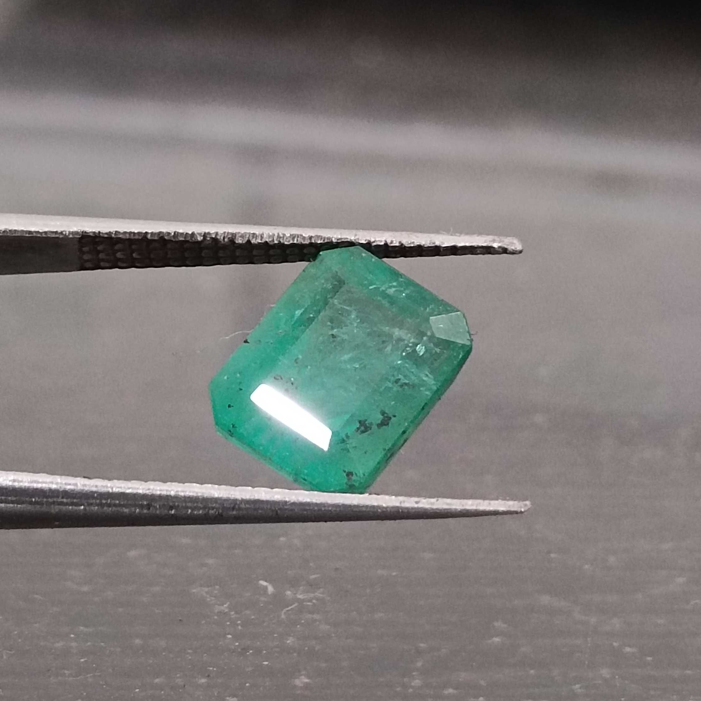 3.28ct medium vivid green emerald cut emerald