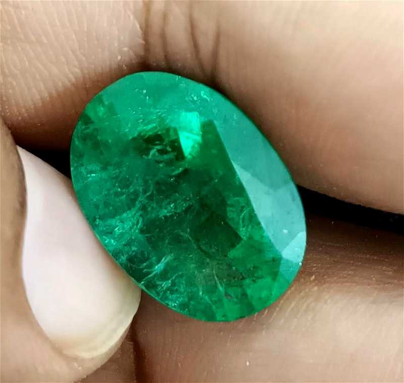 12.91ct vivid golden green color oval cut emerald/