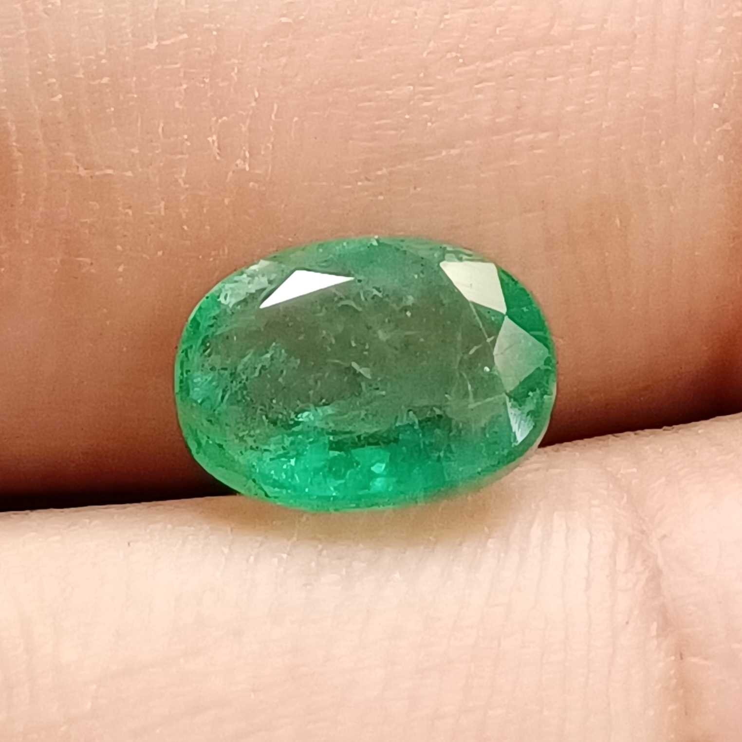2.56 medium deep green oval cut emerald gemstone /
