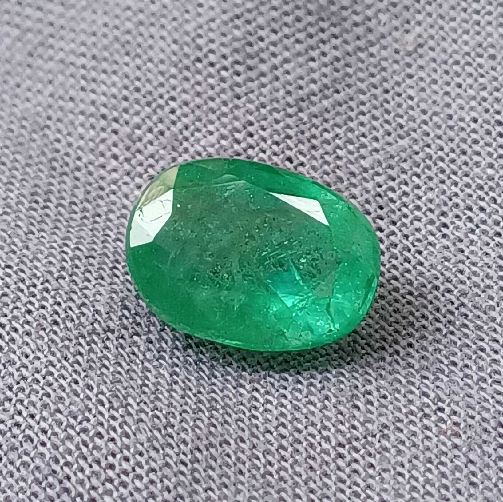 2.56 medium deep green oval cut emerald gemstone 