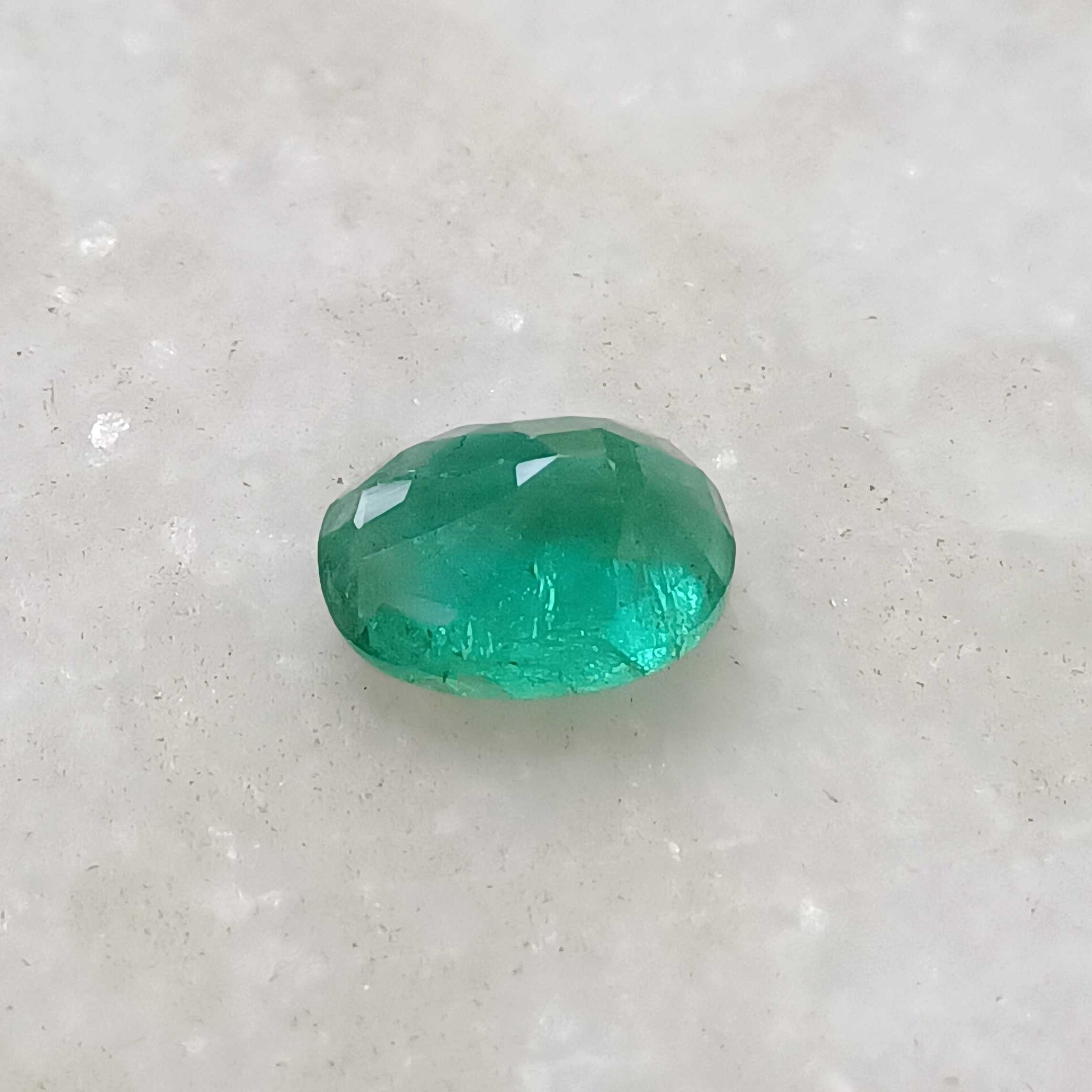 2.56 medium deep green oval cut emerald gemstone 