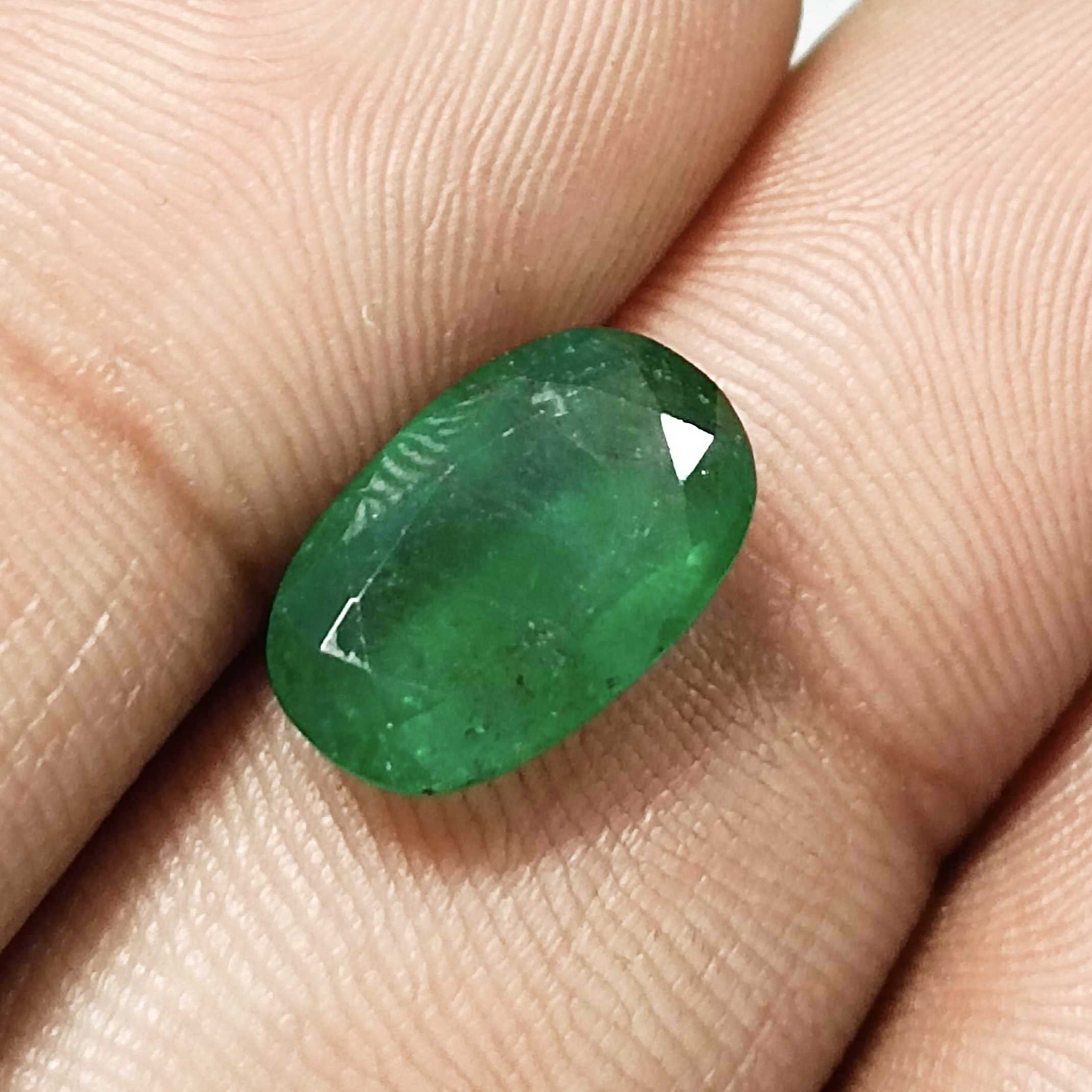 4.36ct deep green elongated oval cut Zambian emerald | Jewelfields/