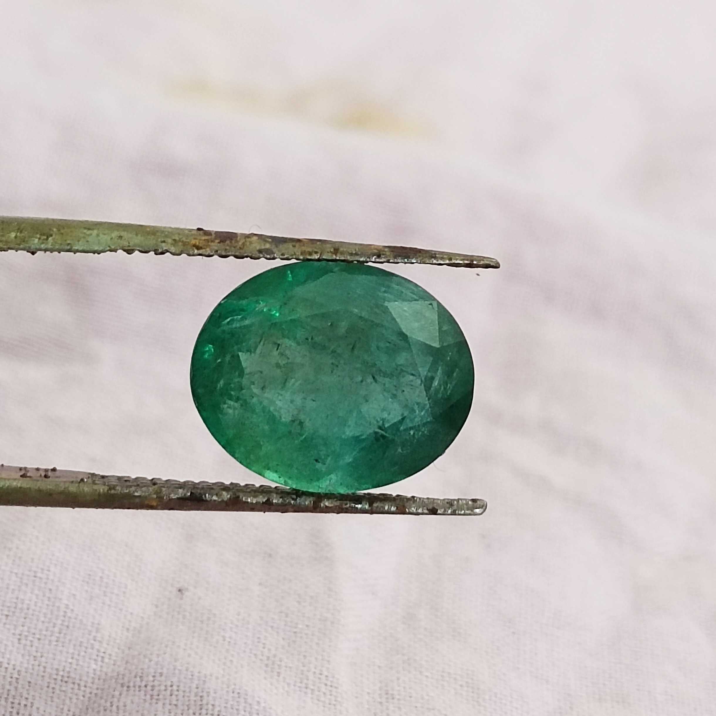 5.31ct deep forest green oval cut emerald gem