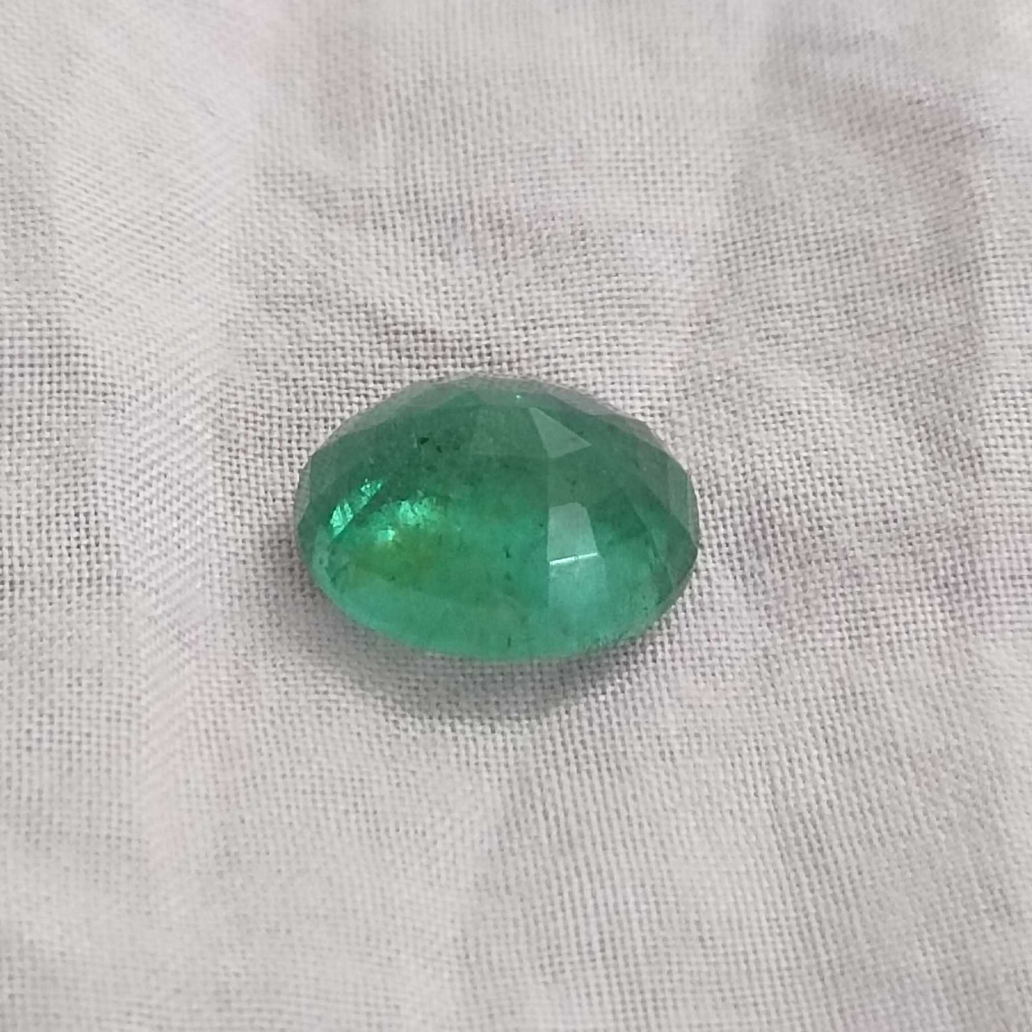 5.31ct deep forest green oval cut emerald gem