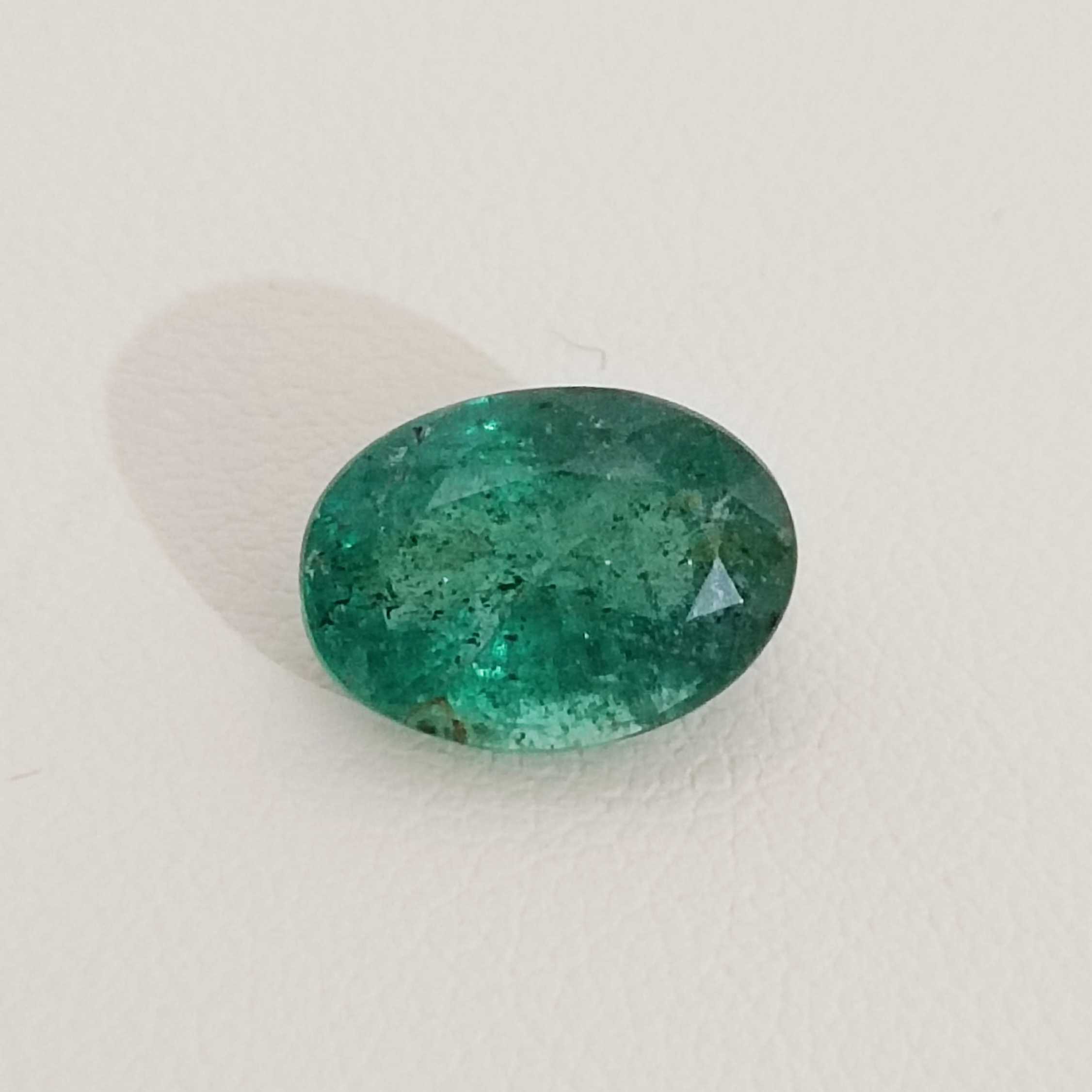 2.88ct deep golden green oval cut emerald