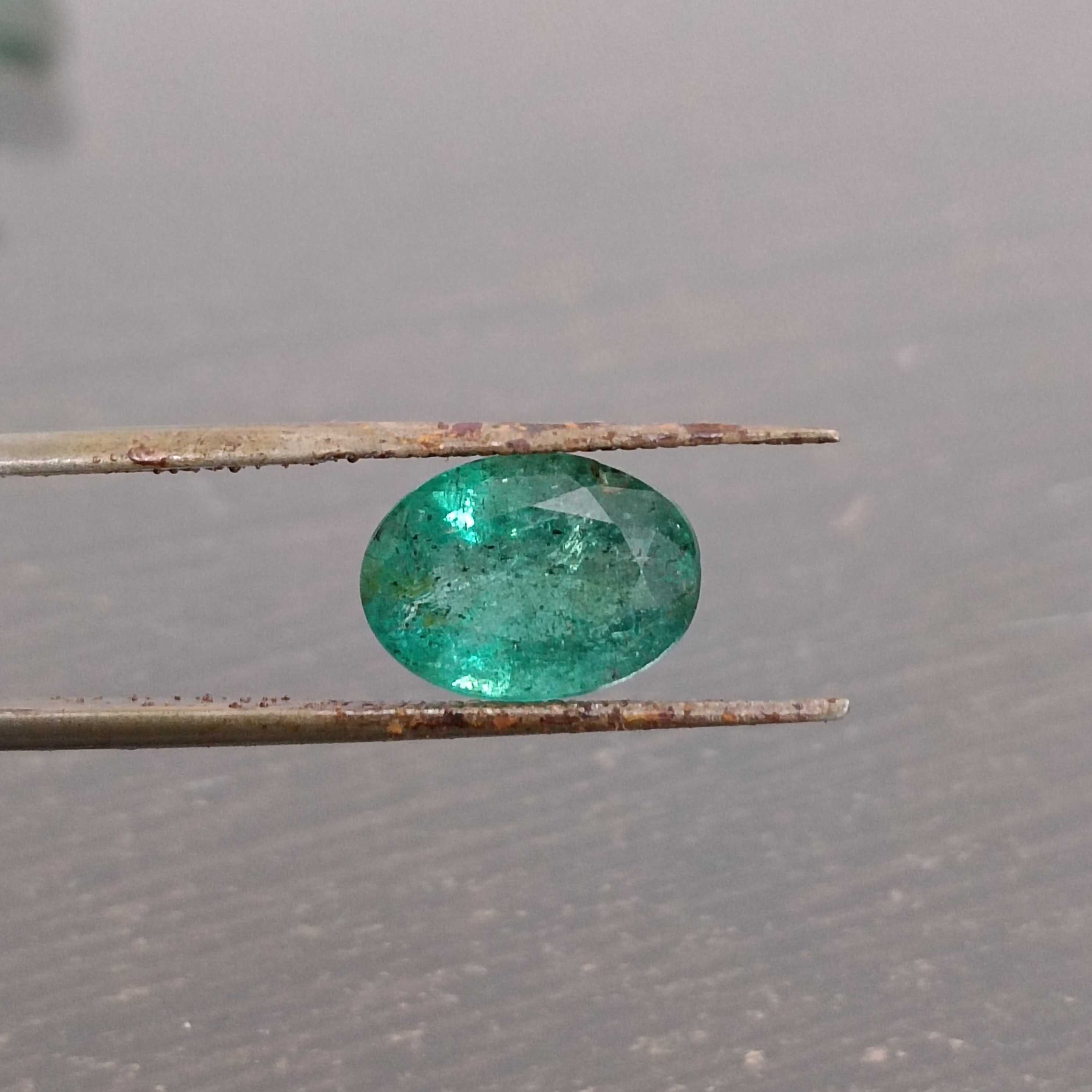 2.88ct deep golden green oval cut emerald