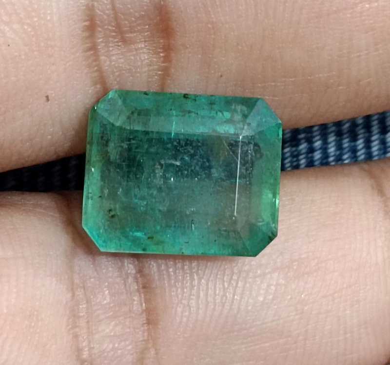 11.94ct certified medium light green octagon cut emerald