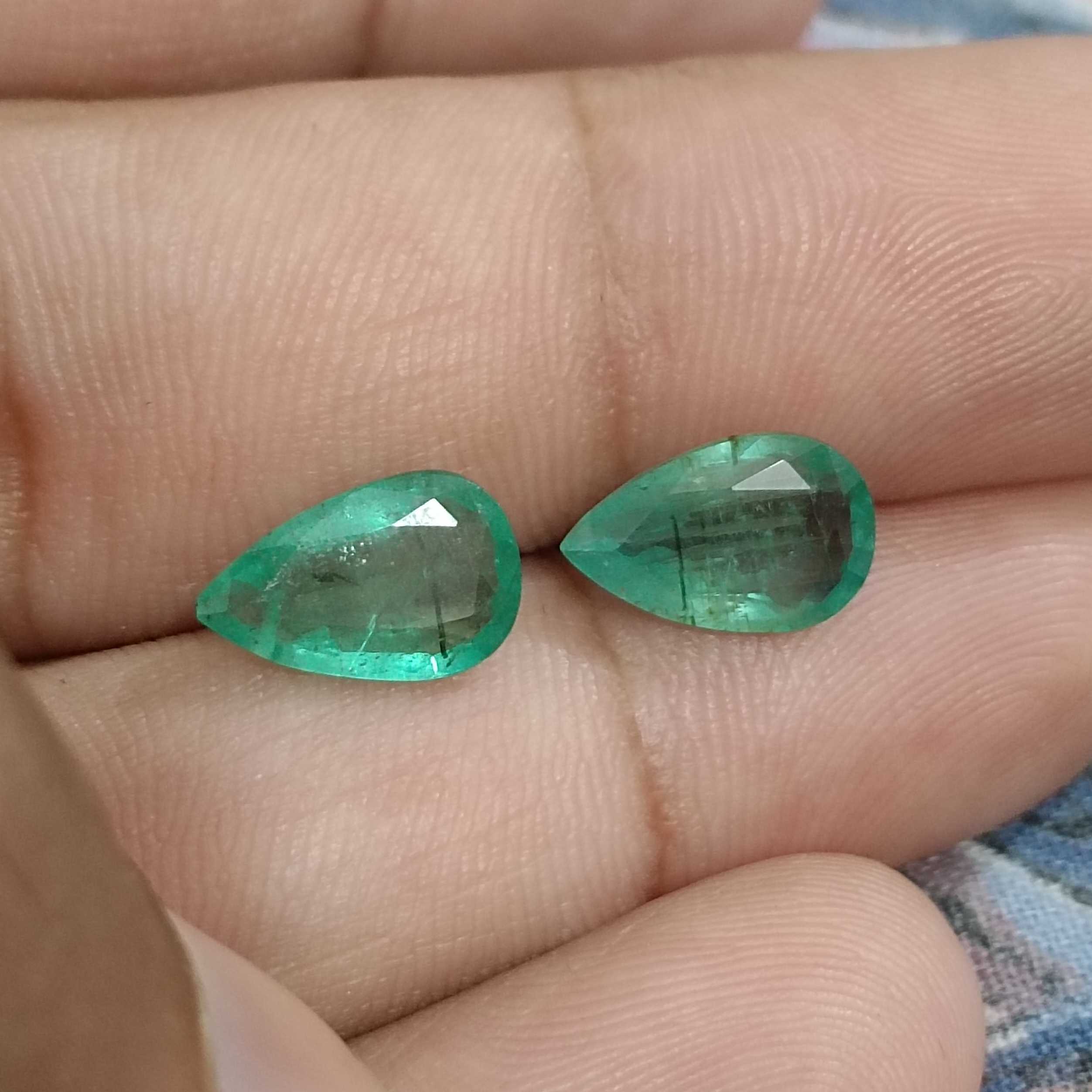 3.67ct medium green pear cut emerald pair /