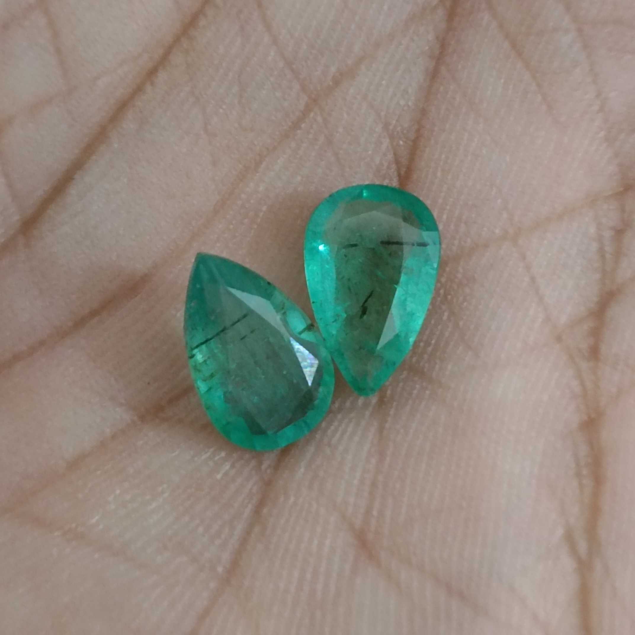 3.67ct medium green pear cut emerald pair 