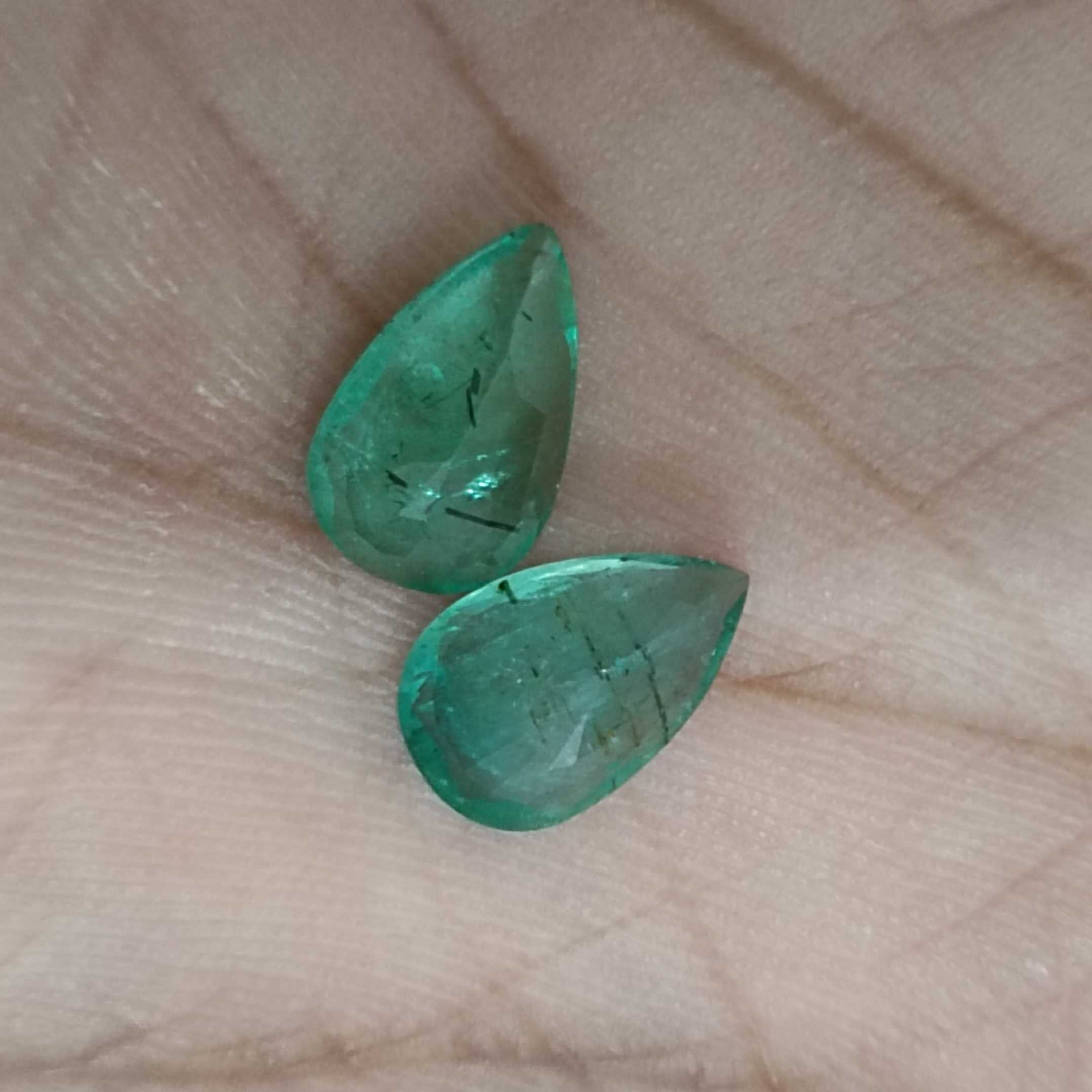 3.67ct medium green pear cut emerald pair 