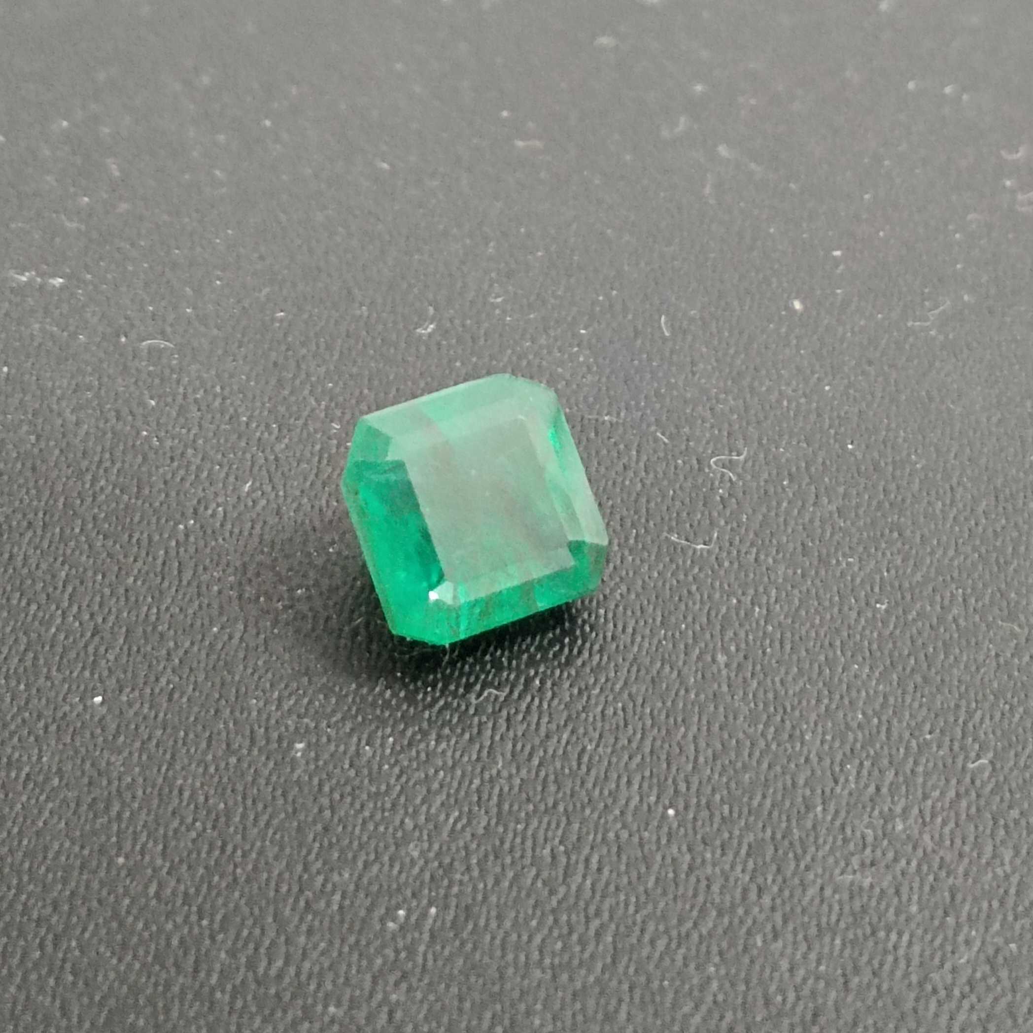 2.28ct deep green emerald gem with bluish and yellowish hue 