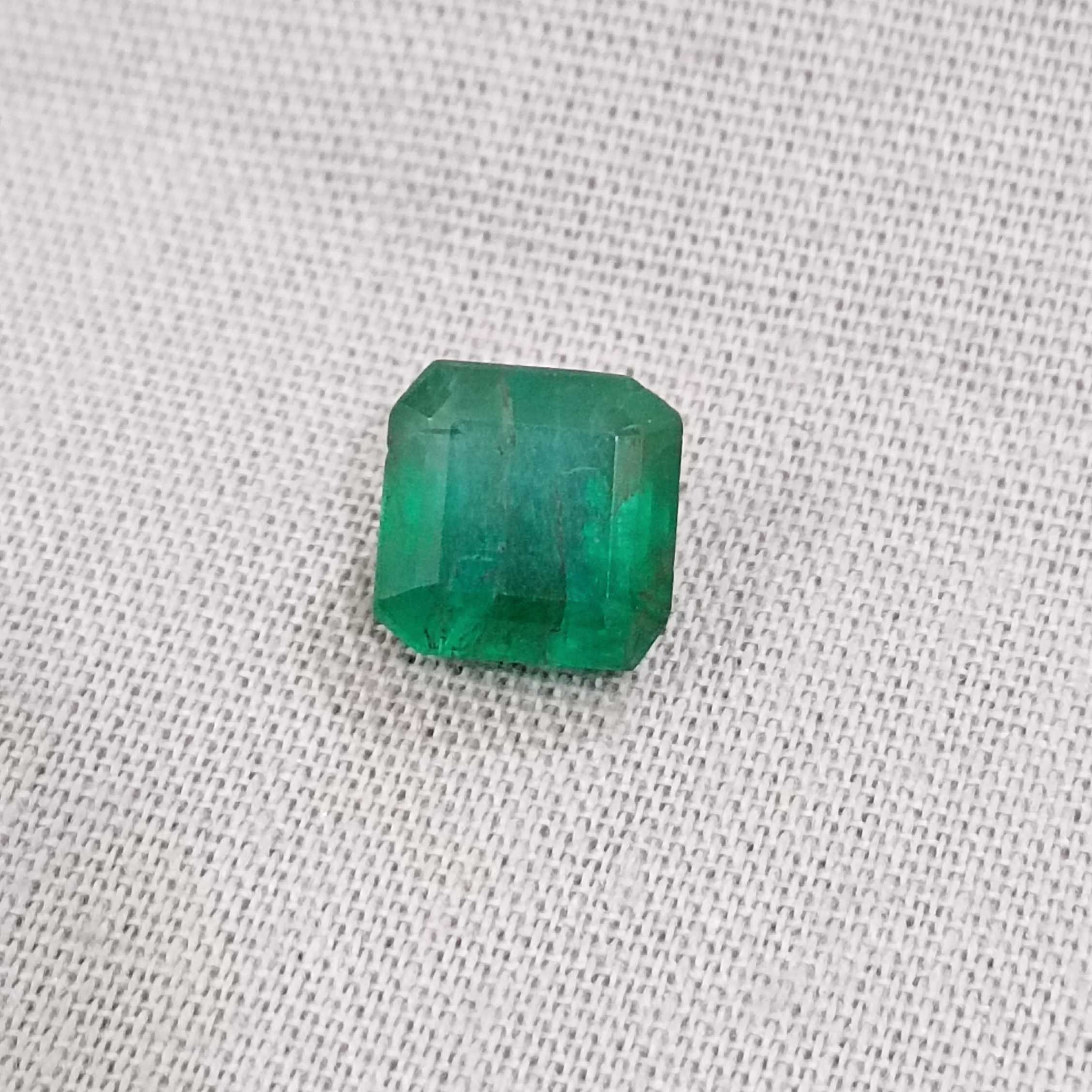 2.28ct deep green emerald gem with bluish and yellowish hue 