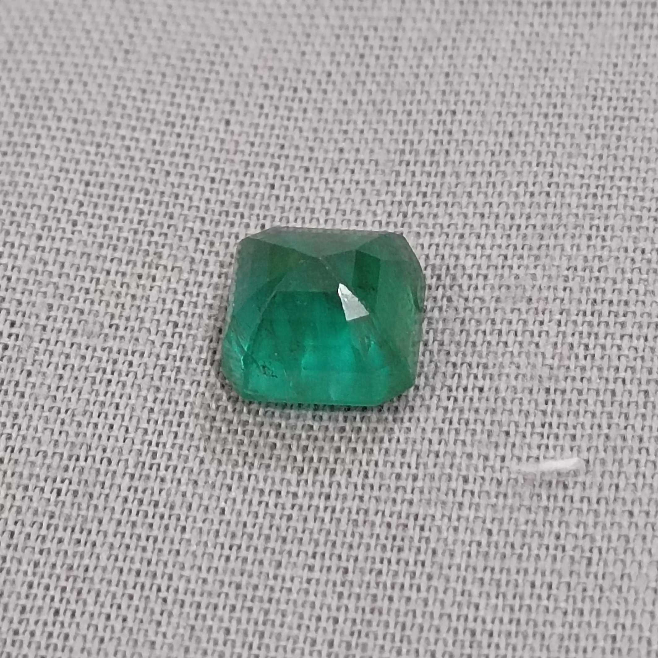 2.28ct deep green emerald gem with bluish and yellowish hue 