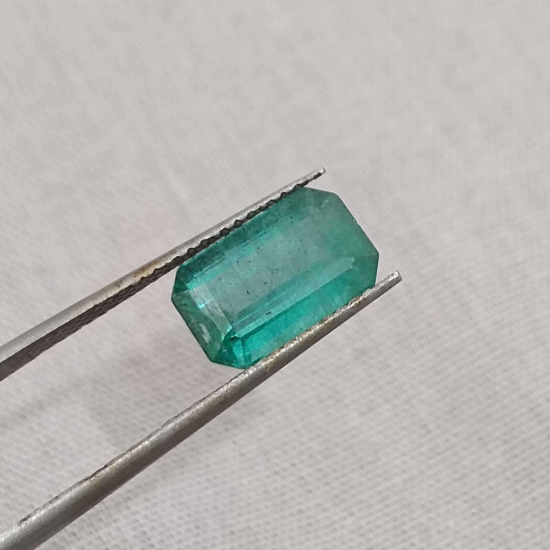 2.42ct deep medium green with blue tint octagon Zambian emerald