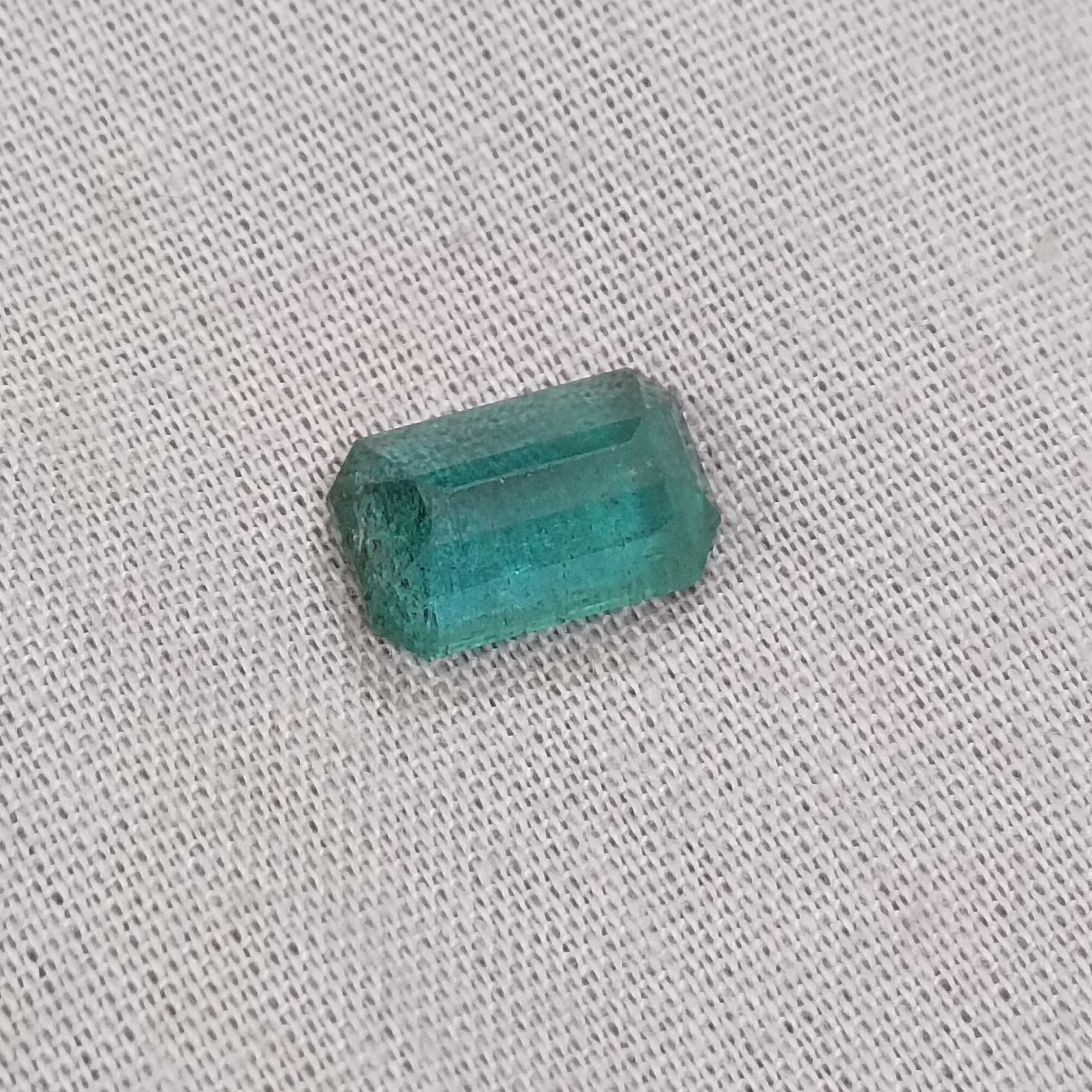 2.42ct deep medium green with blue tint octagon Zambian emerald