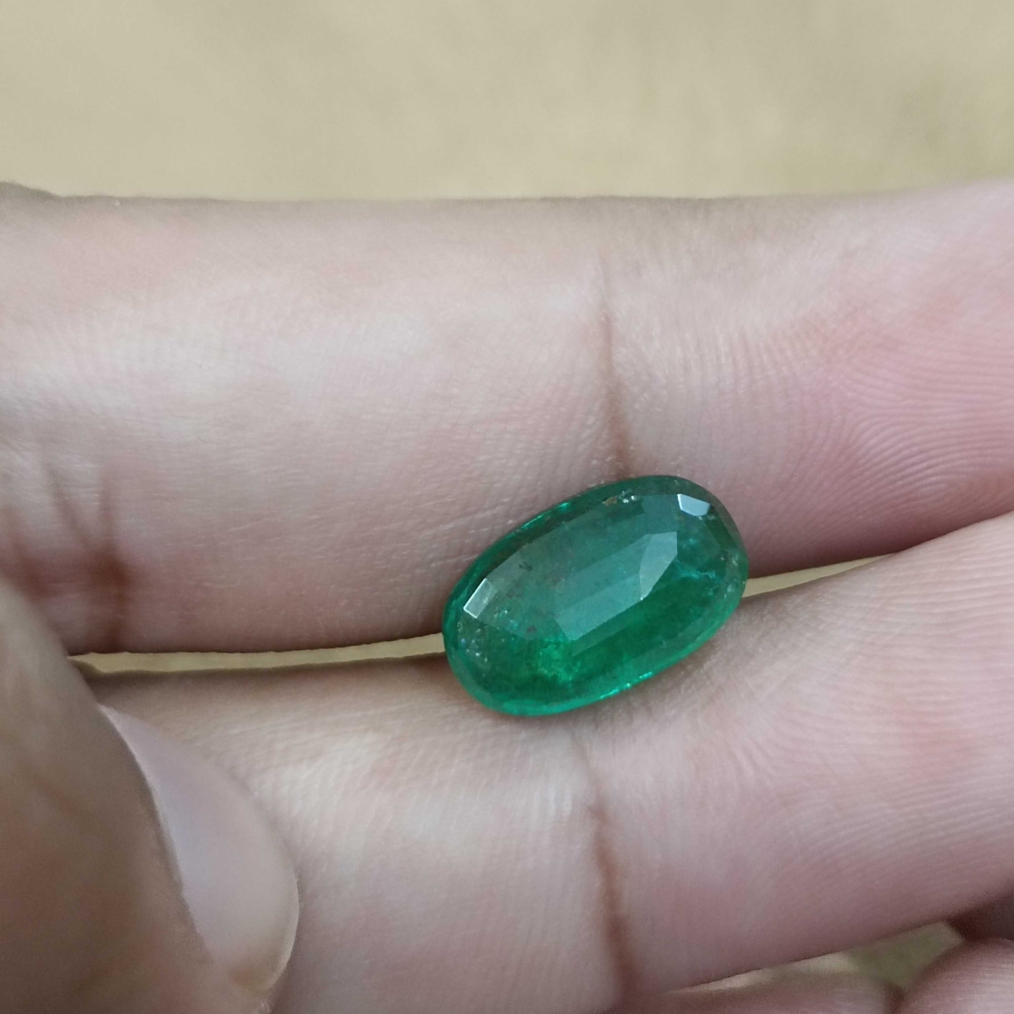 4.36ct deep green elongated oval cut Zambian emerald gem 