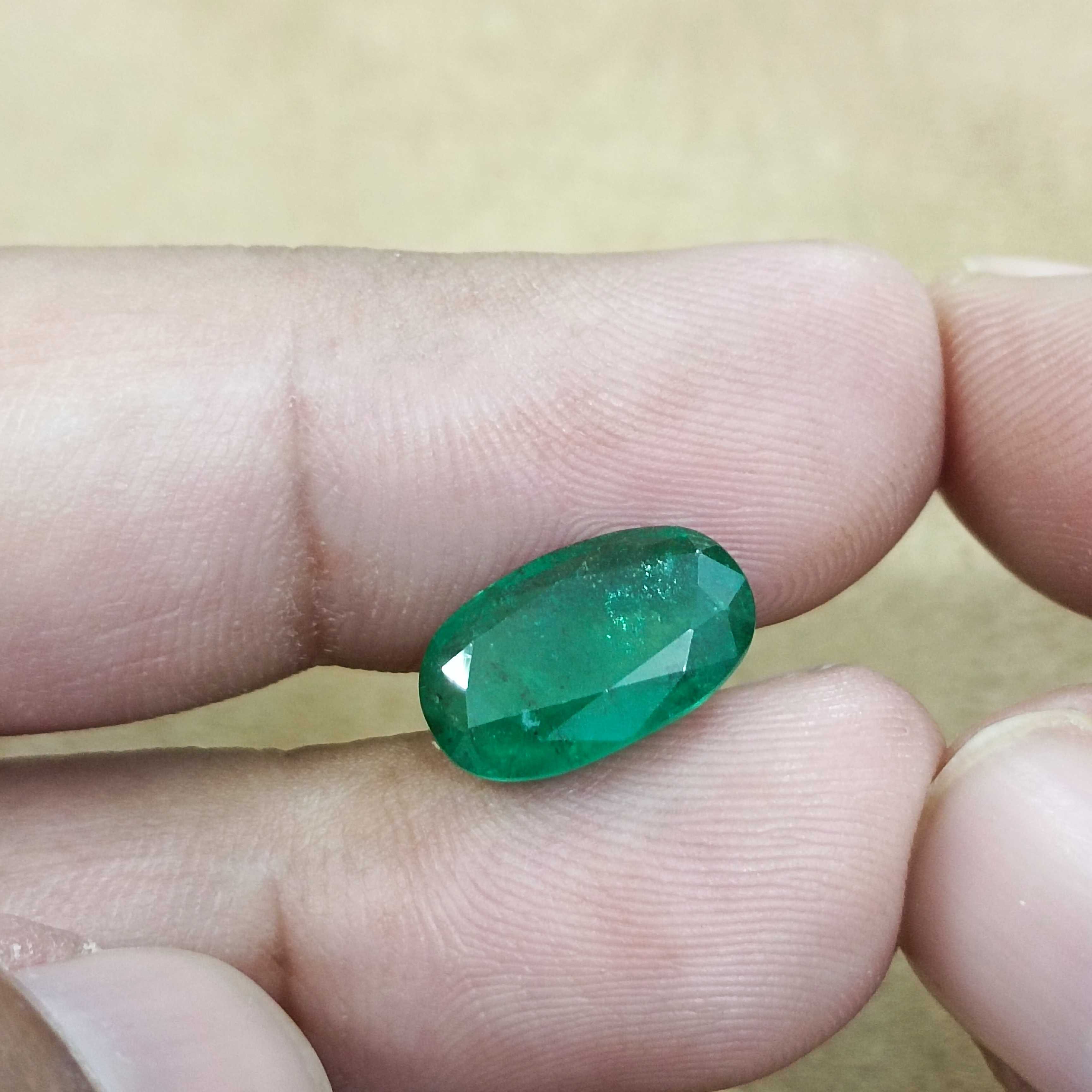 4.36ct deep green elongated oval cut Zambian emerald gem 