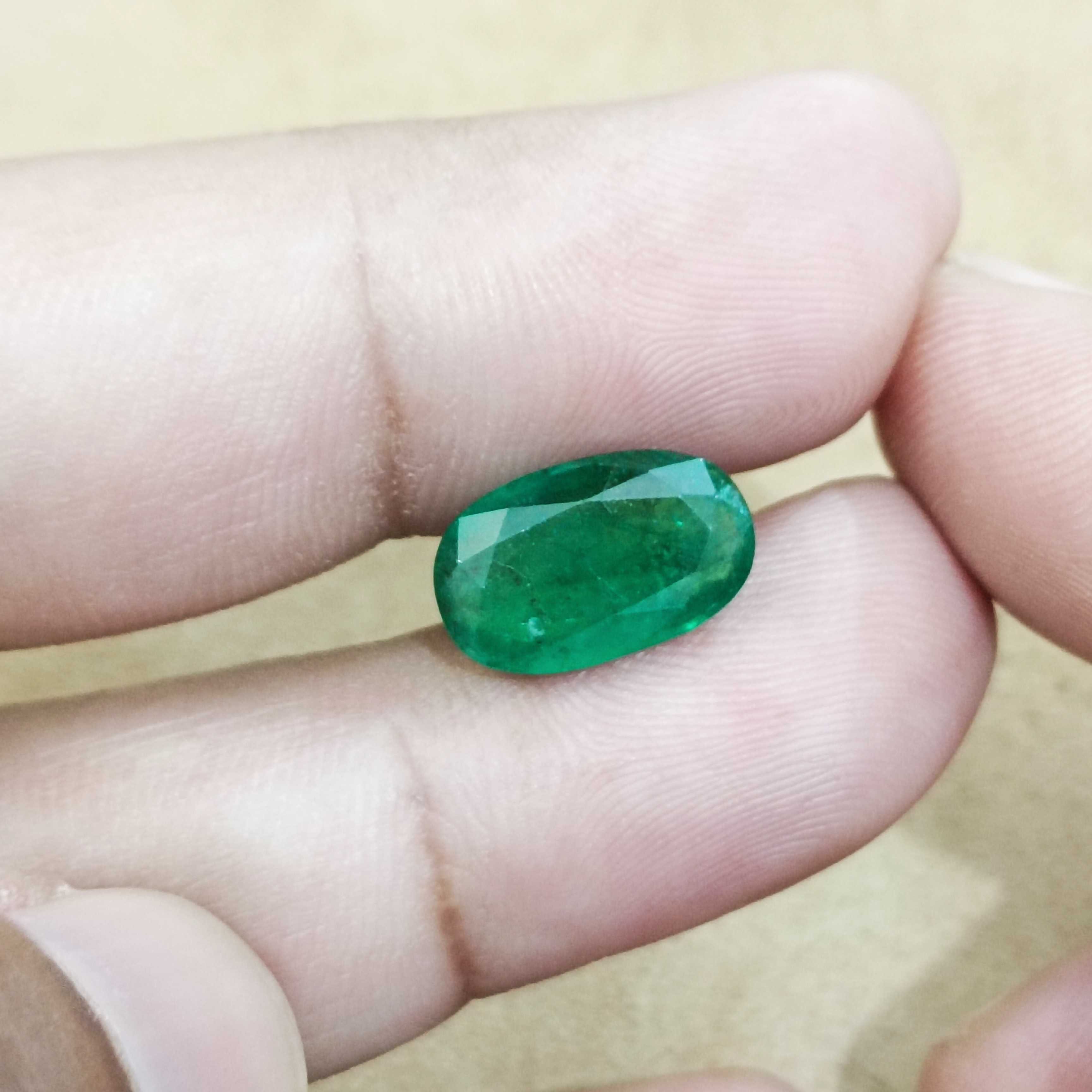 4.36ct deep green elongated oval cut Zambian emerald gem 