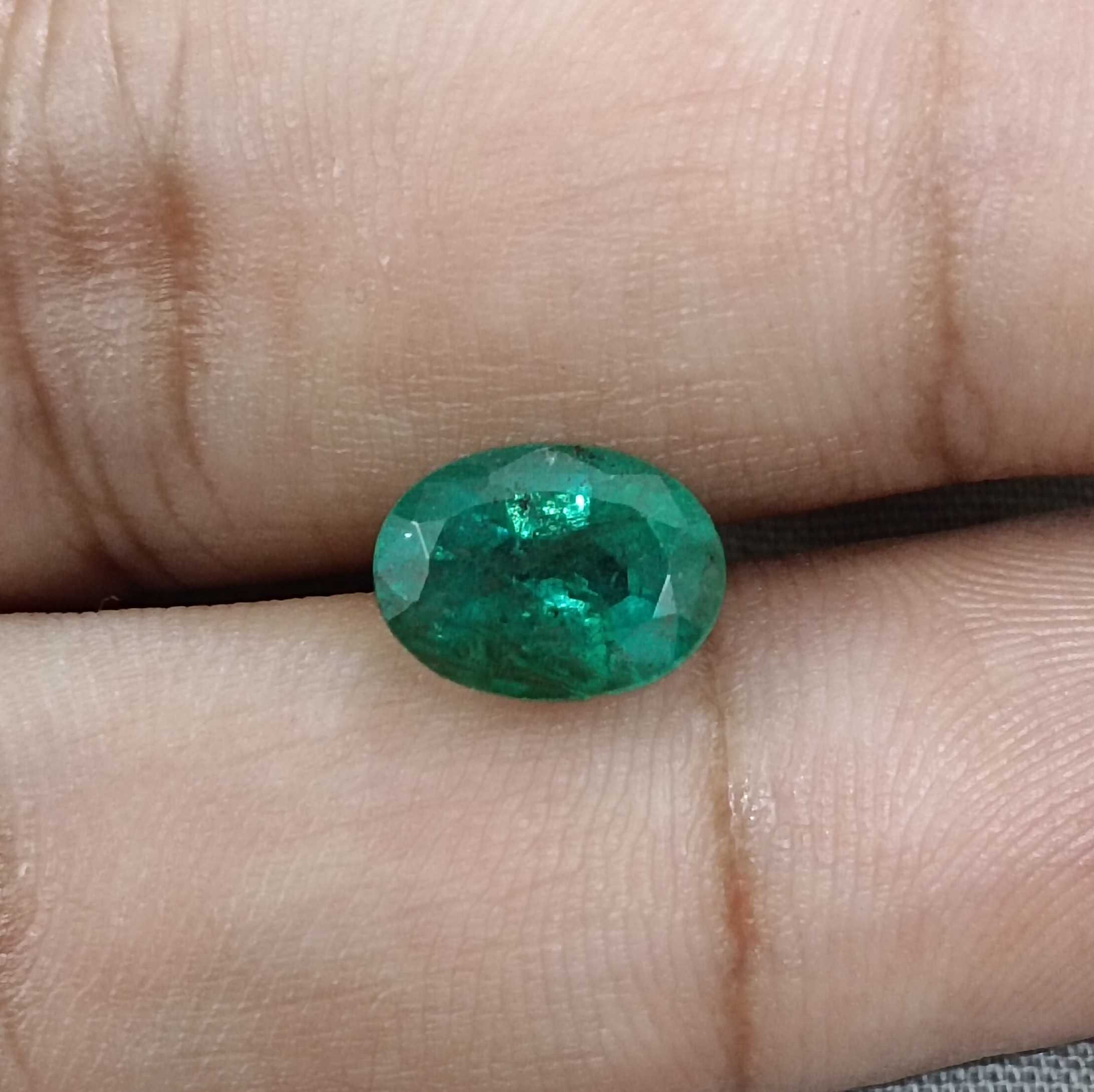 2.45ct deep forest green in gold tint oval cut emerald 