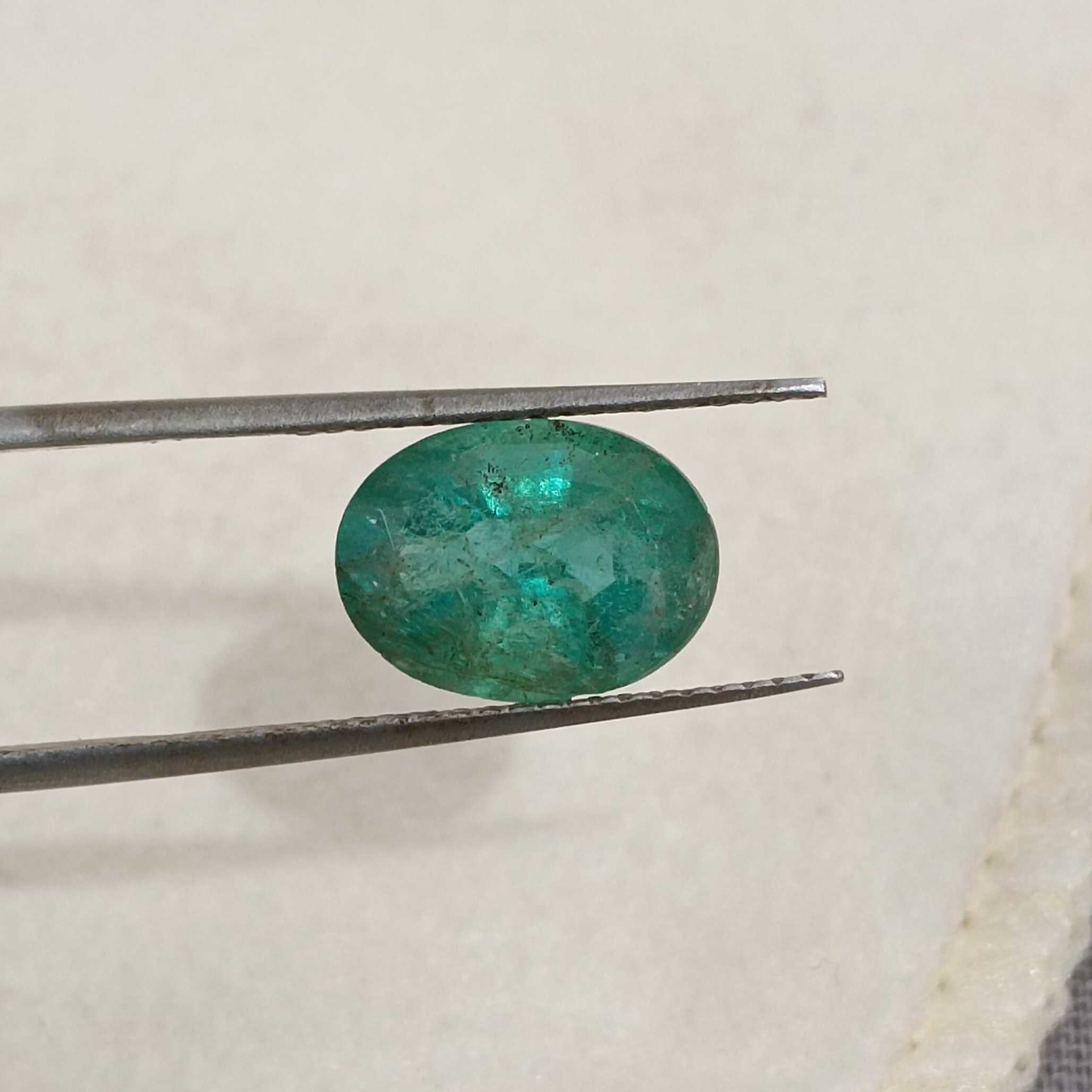 2.45ct deep forest green in gold tint oval cut emerald 