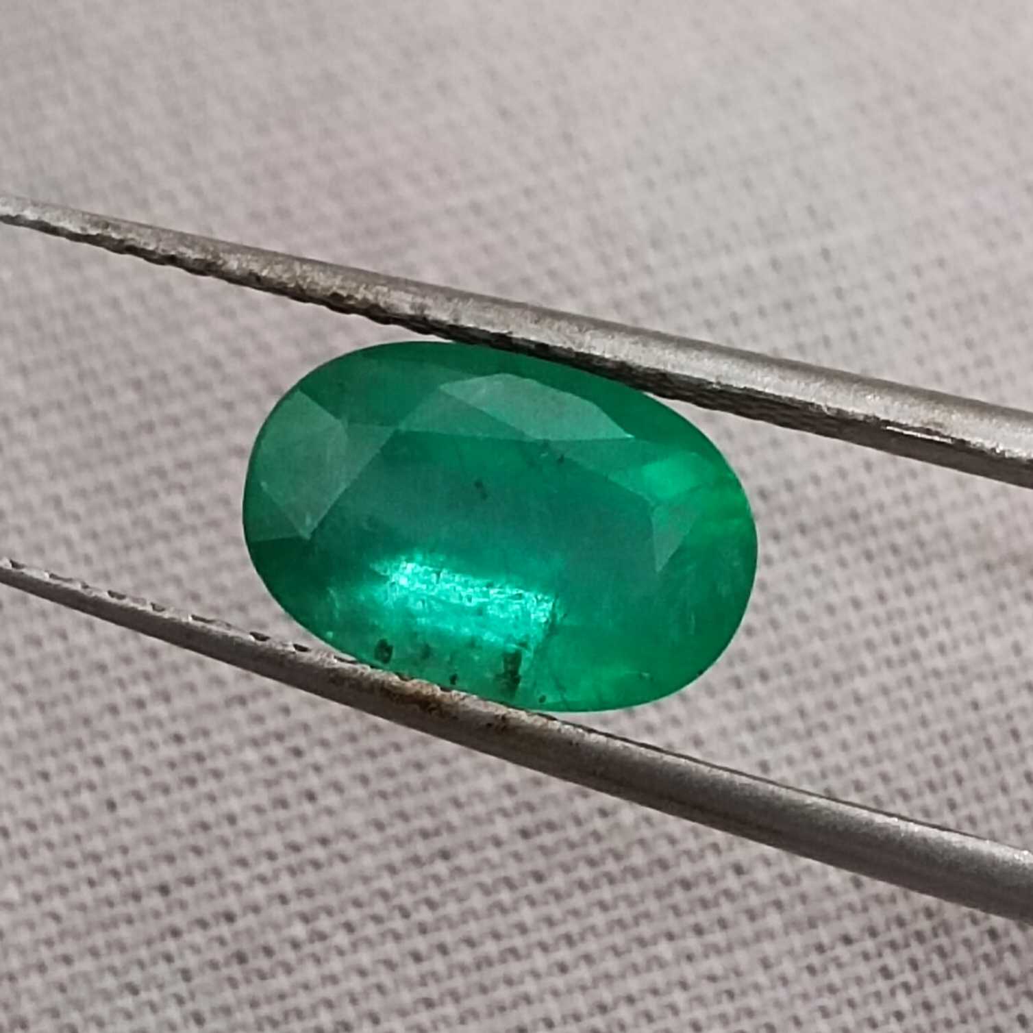 2.16ct misty golden green oval cut Colombian emerald gem