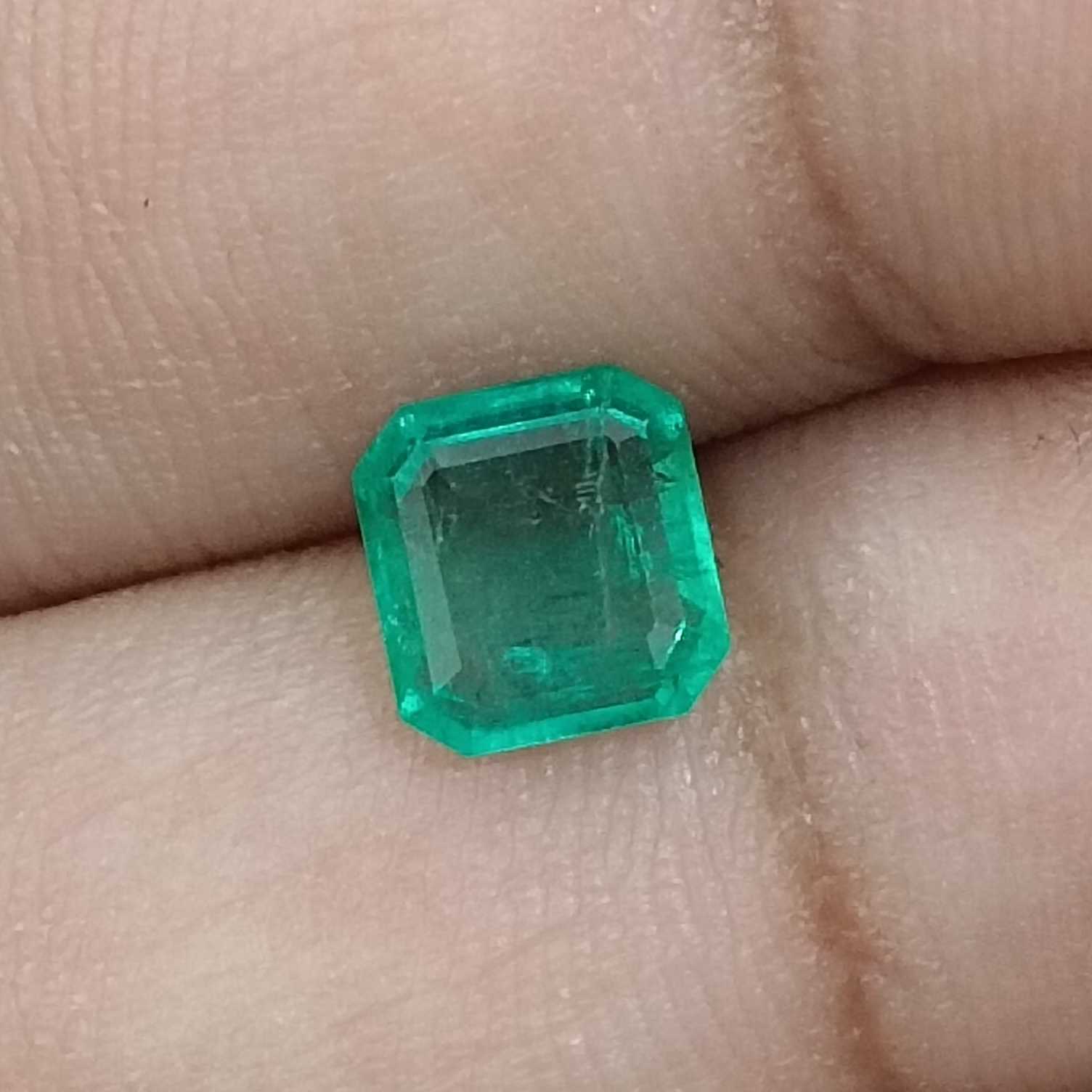 1.31ct deep pure green emerald cut emerald stone